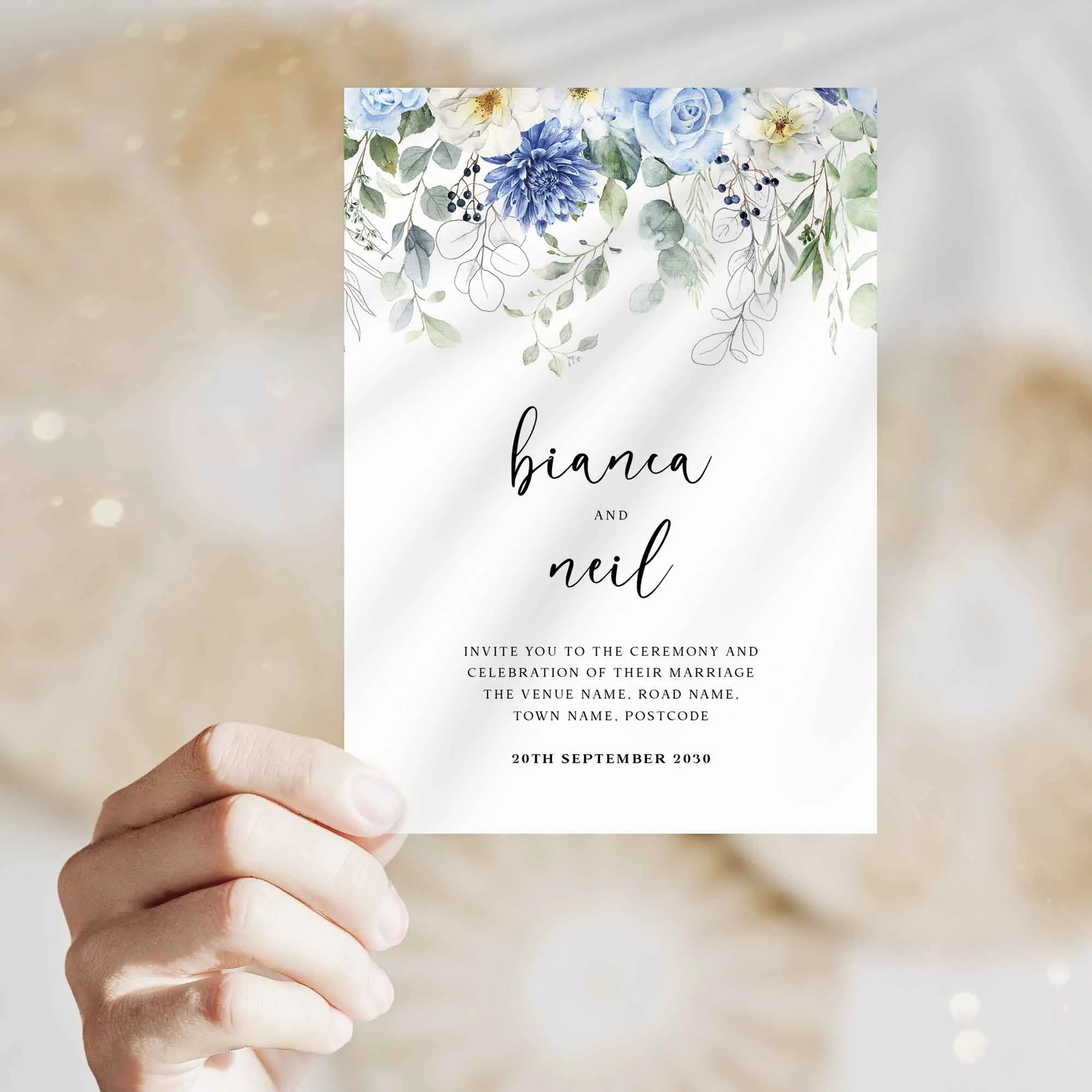 Hand holding Blue Floral Drop wedding invitation showing size and printed design details
