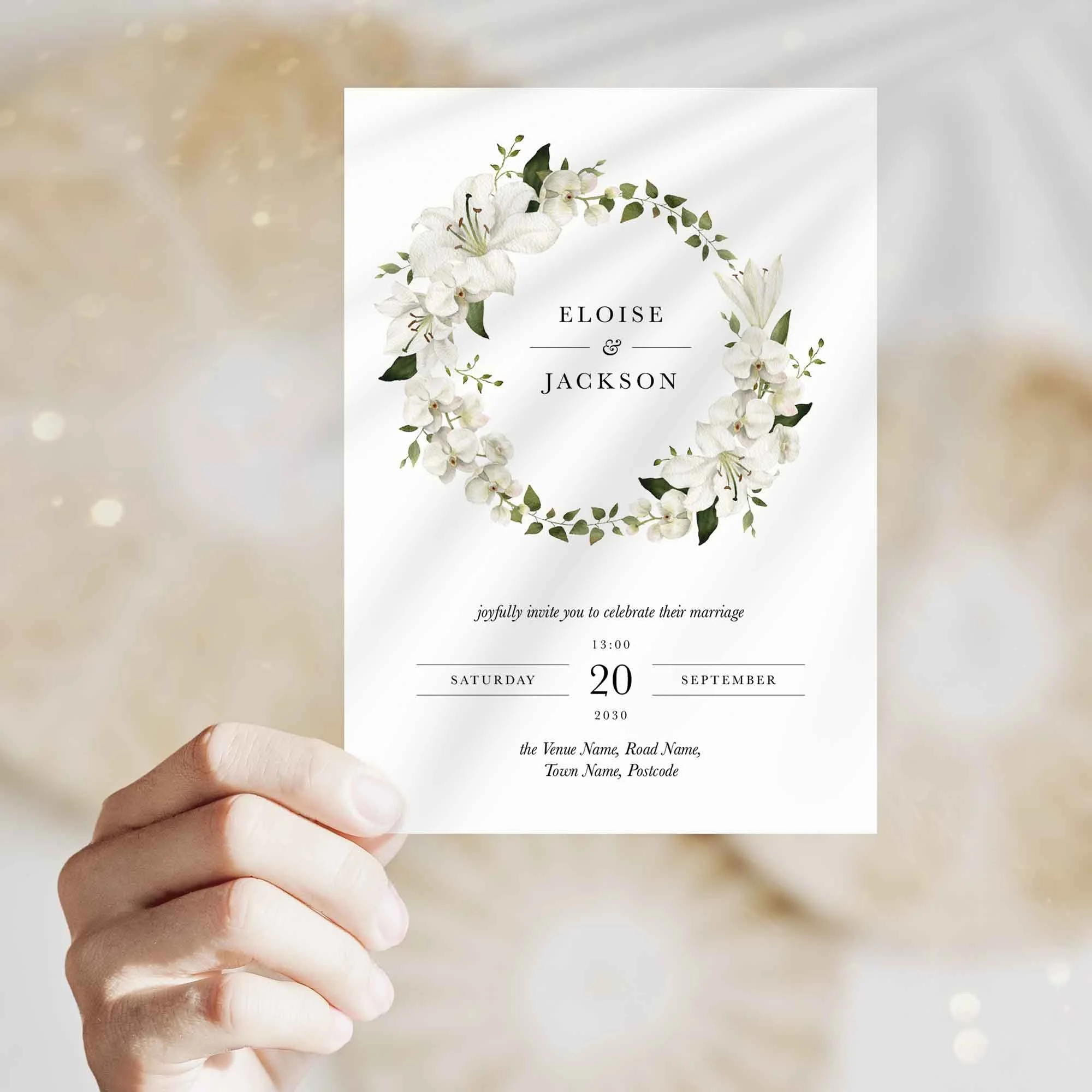 Hand holding White Lily Wreath wedding invitation showing size and printed design details