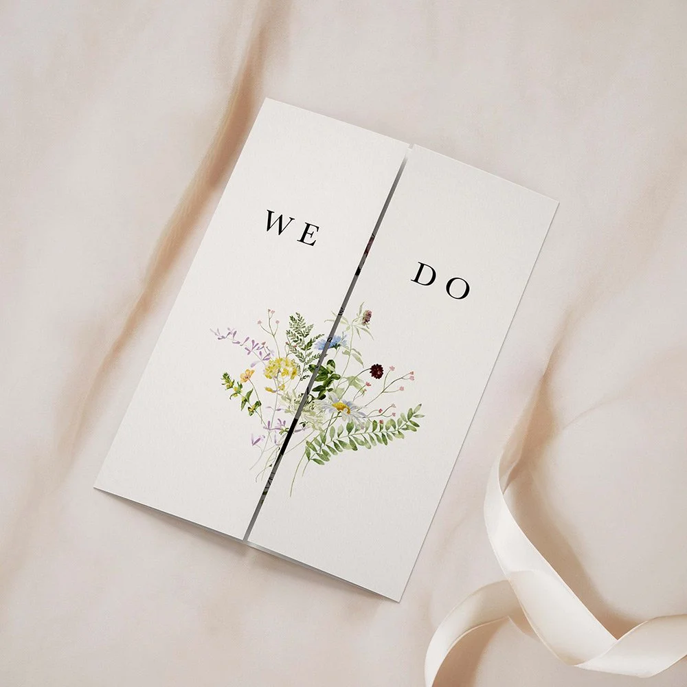 Meadow gatefold wedding invitation with soft wildflowers and green foliage