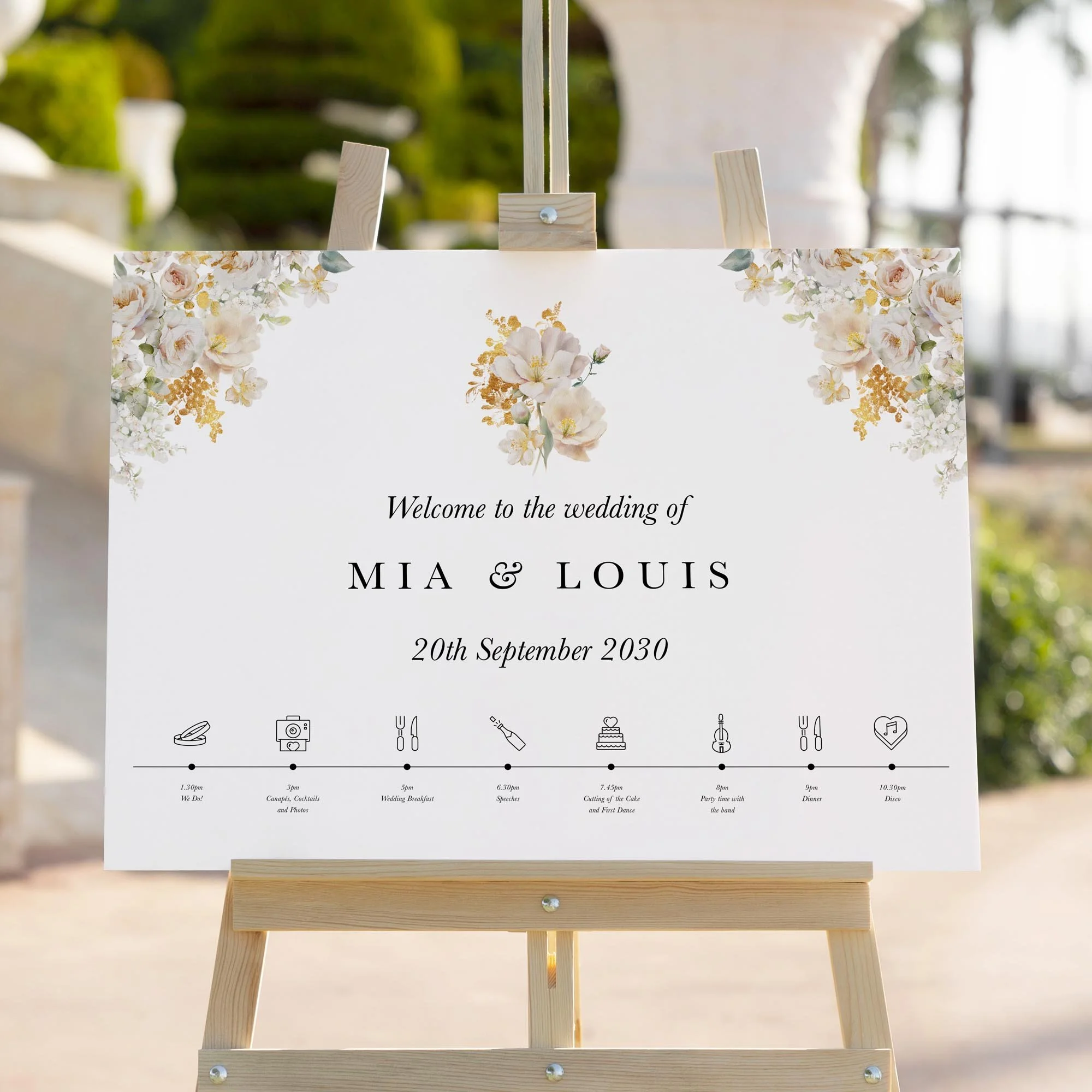 White and Gold Floral wedding welcome sign styled outdoors close-up
