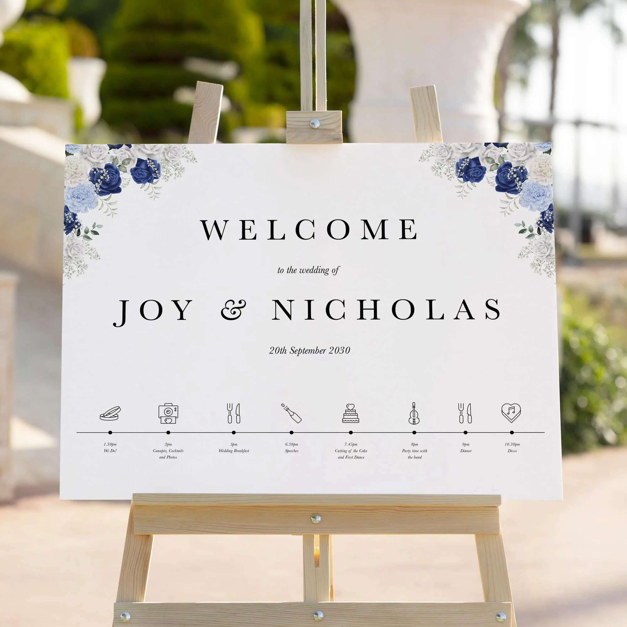 Blue and White Floral with Timeline wedding welcome sign styled outdoors close-up