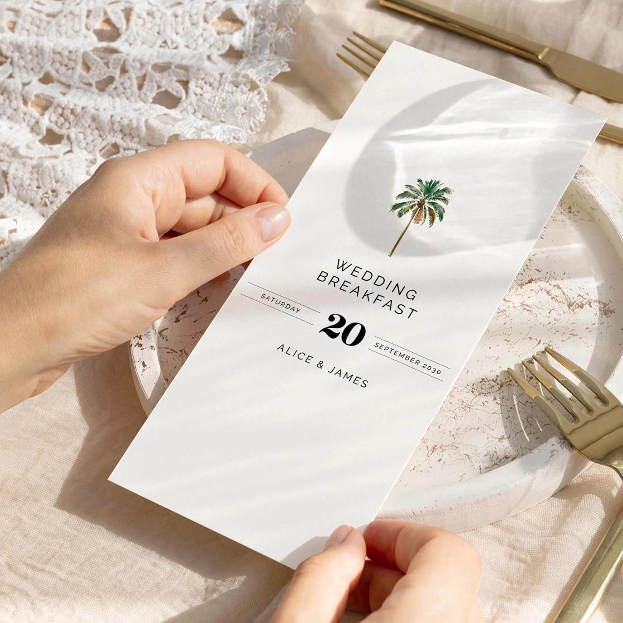 Hand holding Palm Tree wedding menu card showing size and printed design details
