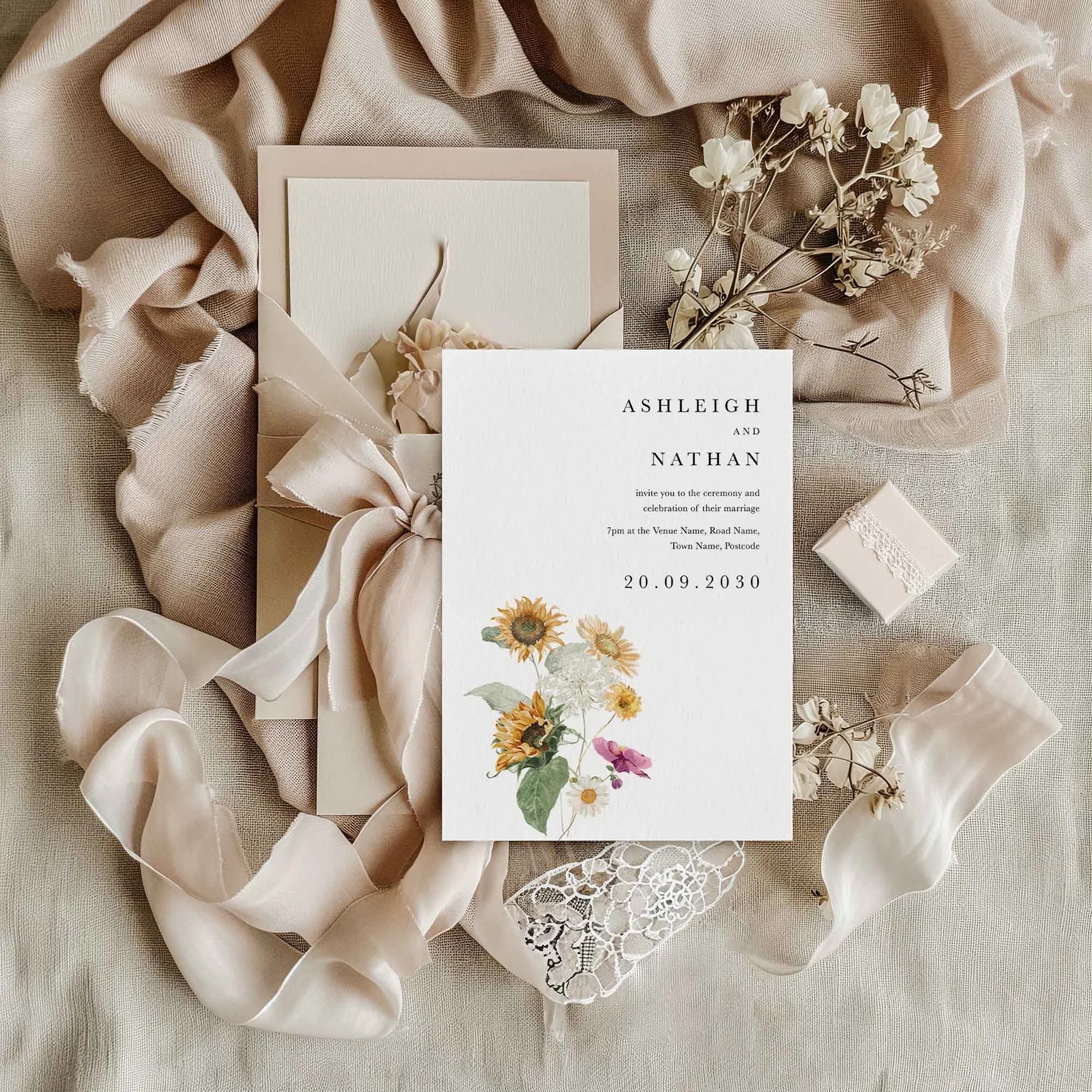 Autumn Sunflower wedding invitation styled in a flat lay environment with wedding props