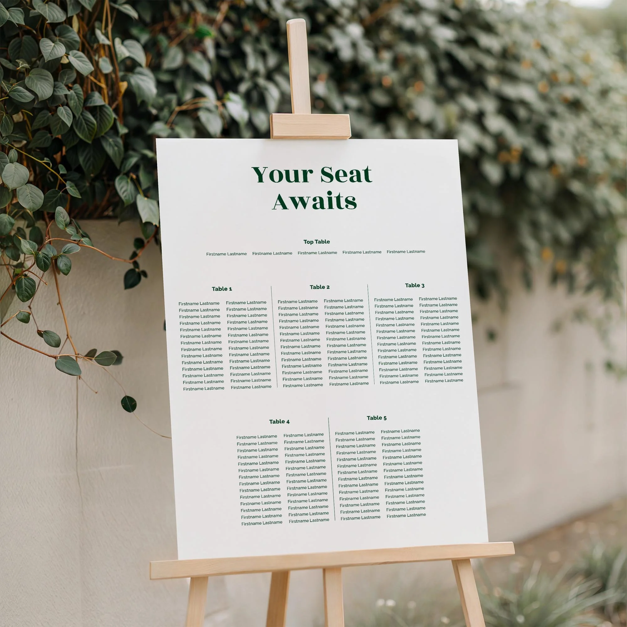 Close-up of the Forest Green Coloured Bold Typography in Contemporary Font wedding seating plan board displayed outdoors