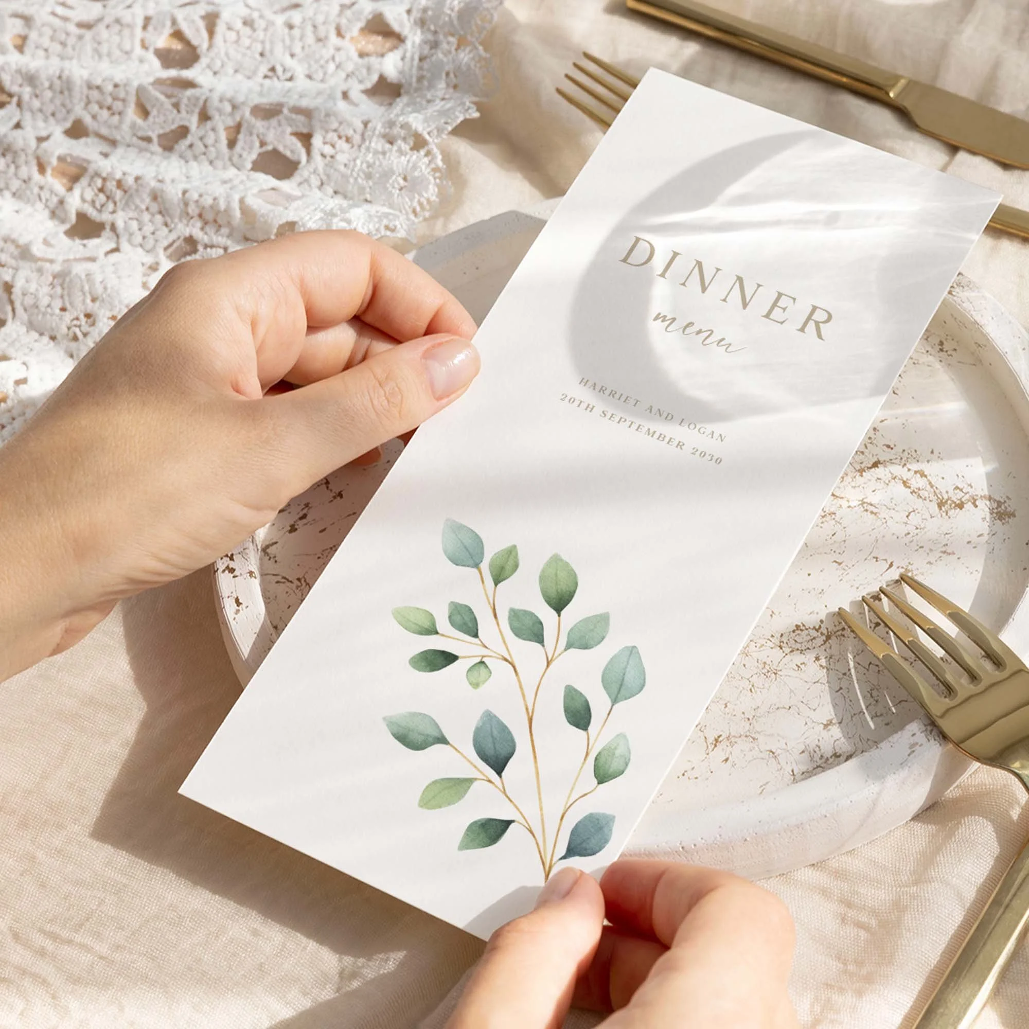 Hand holding Eucalyptus Branch wedding menu card showing size and printed design details
