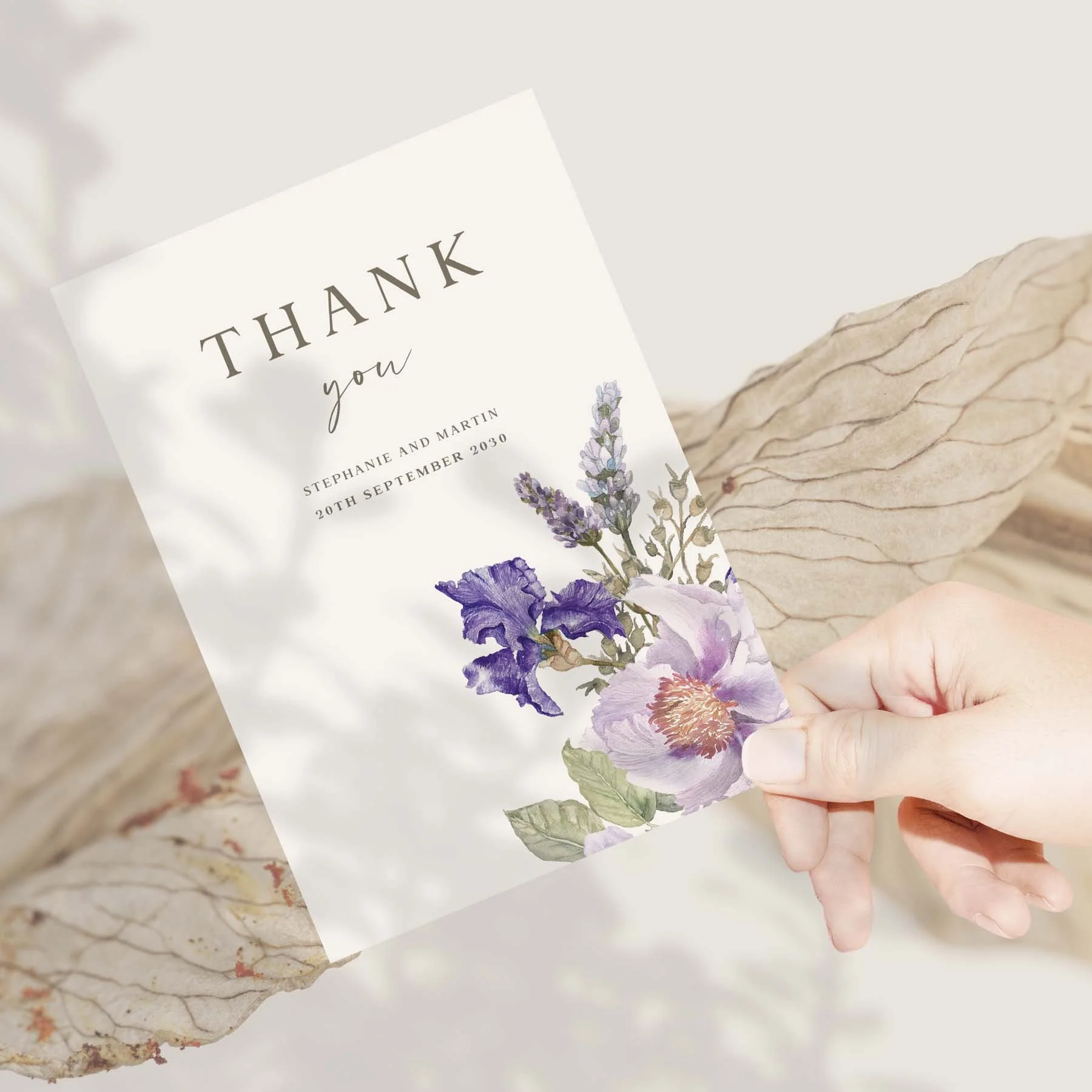 Hand holding a Lilac Floral wedding thank you card