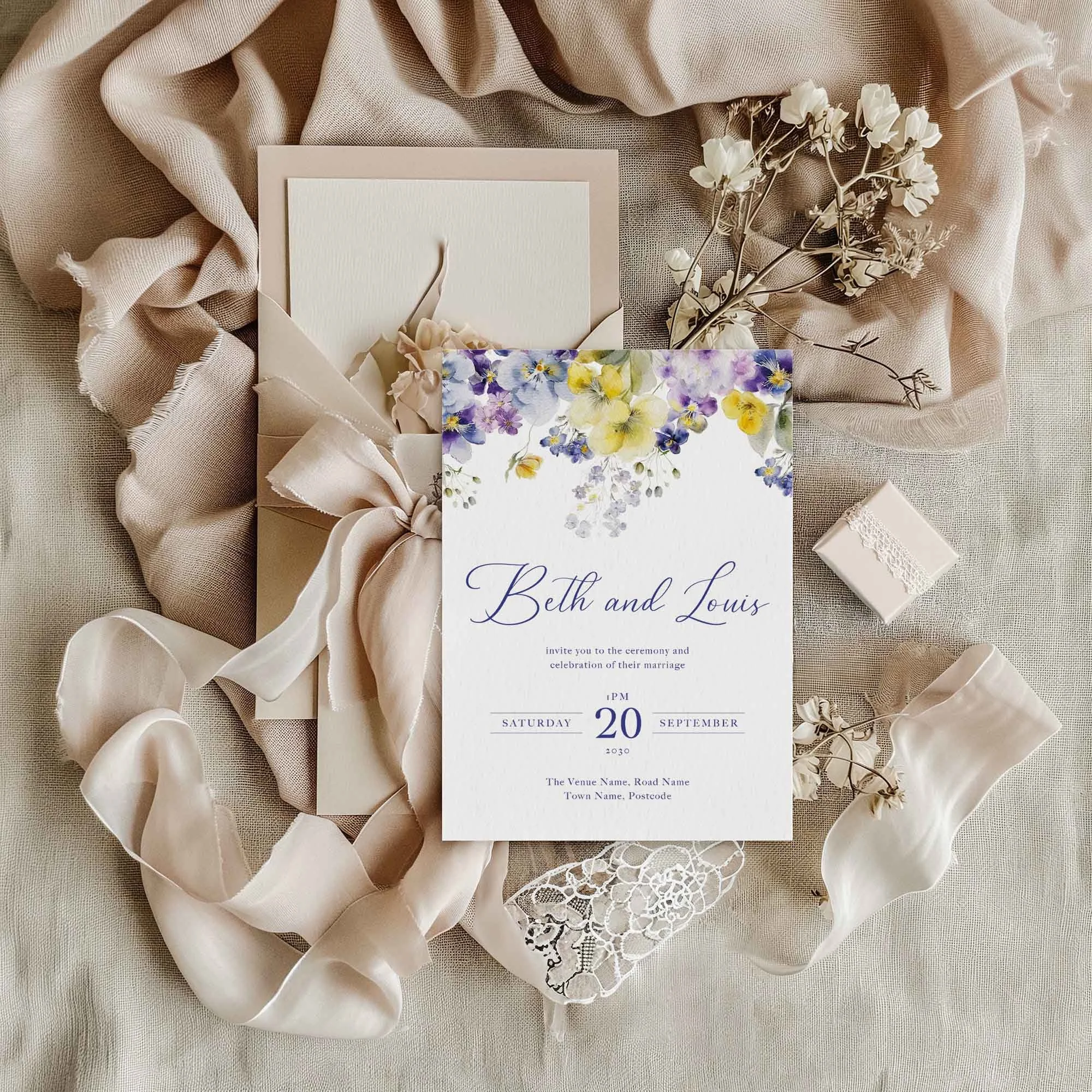 Violet and Yellow wedding invitation styled in a flat lay environment with wedding props