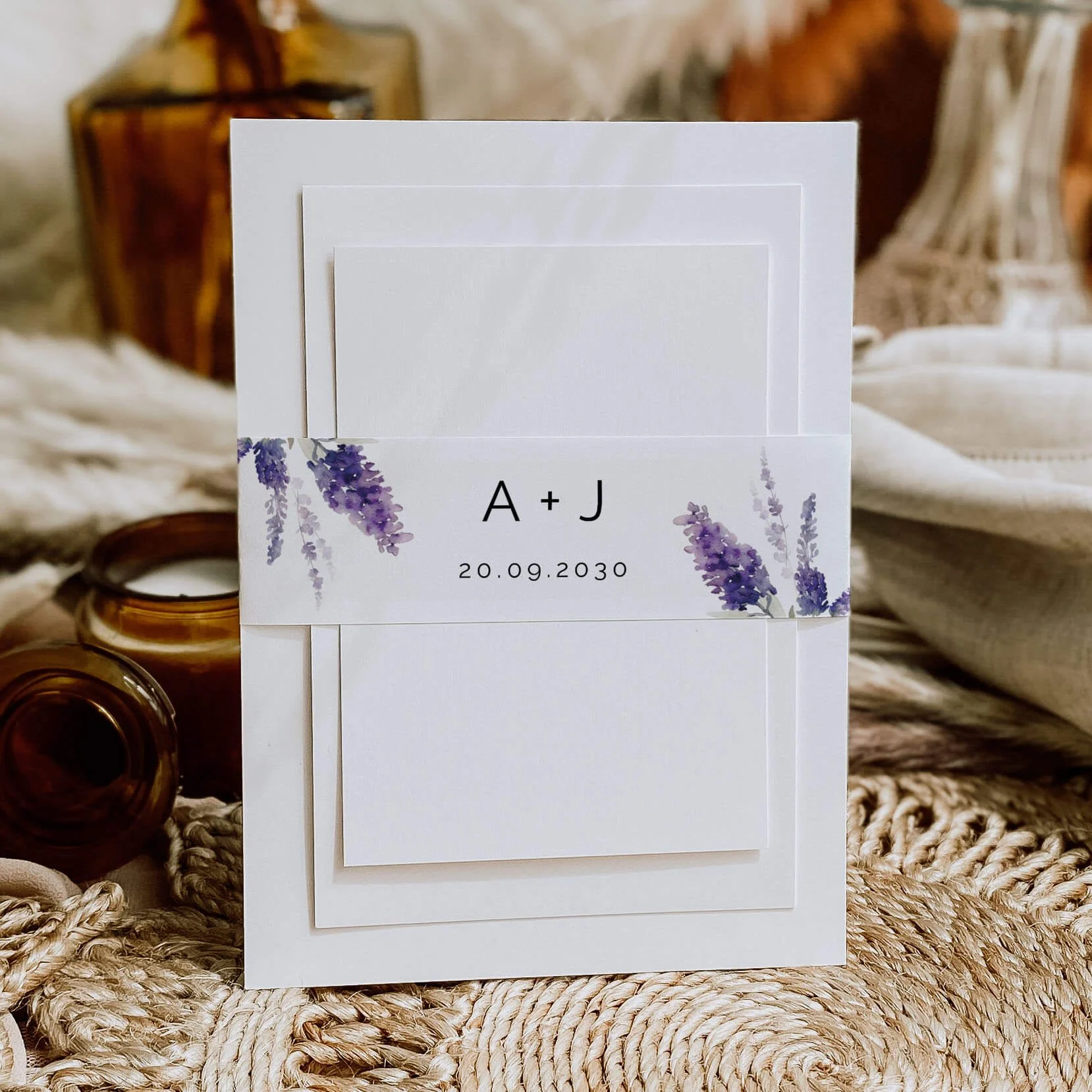 Lavender wedding belly band with purple lavender floral illustrations and modern personalised typography around wedding invitations