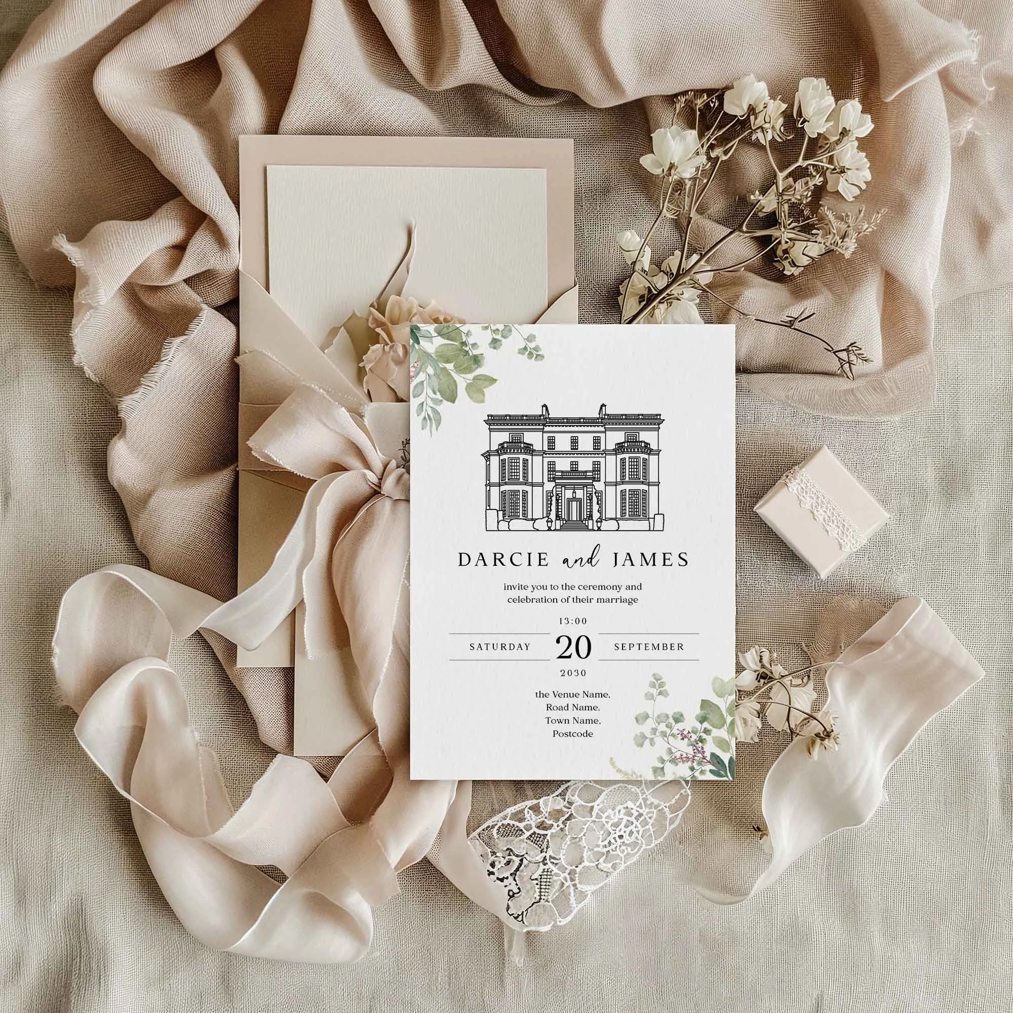 Venue Greenery wedding invitation styled in a flat lay environment with wedding props