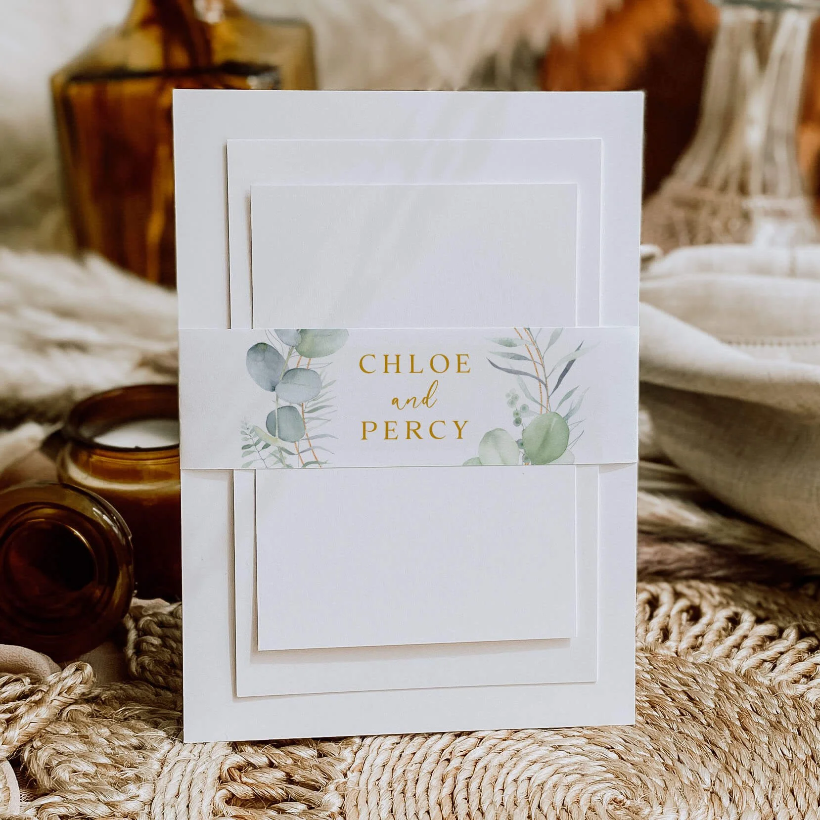 Eucalyptus Frame personalised wedding belly bands with botanical leaf illustration gold geometric frame and serif names wrapped around wedding invitations