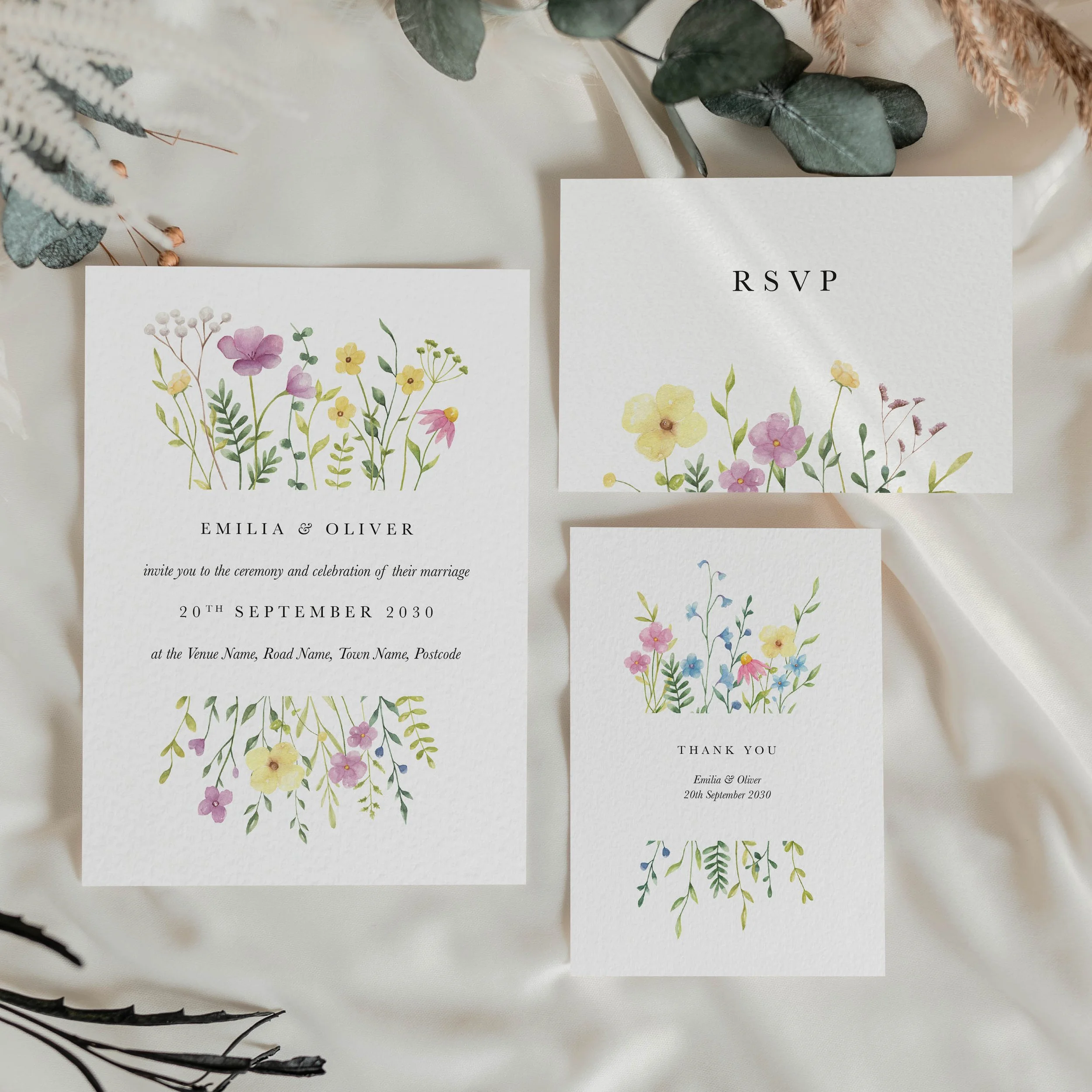 The Wildflower wedding stationery collection featuring RSVP card and invitation with colourful mixed meadow wildflower design