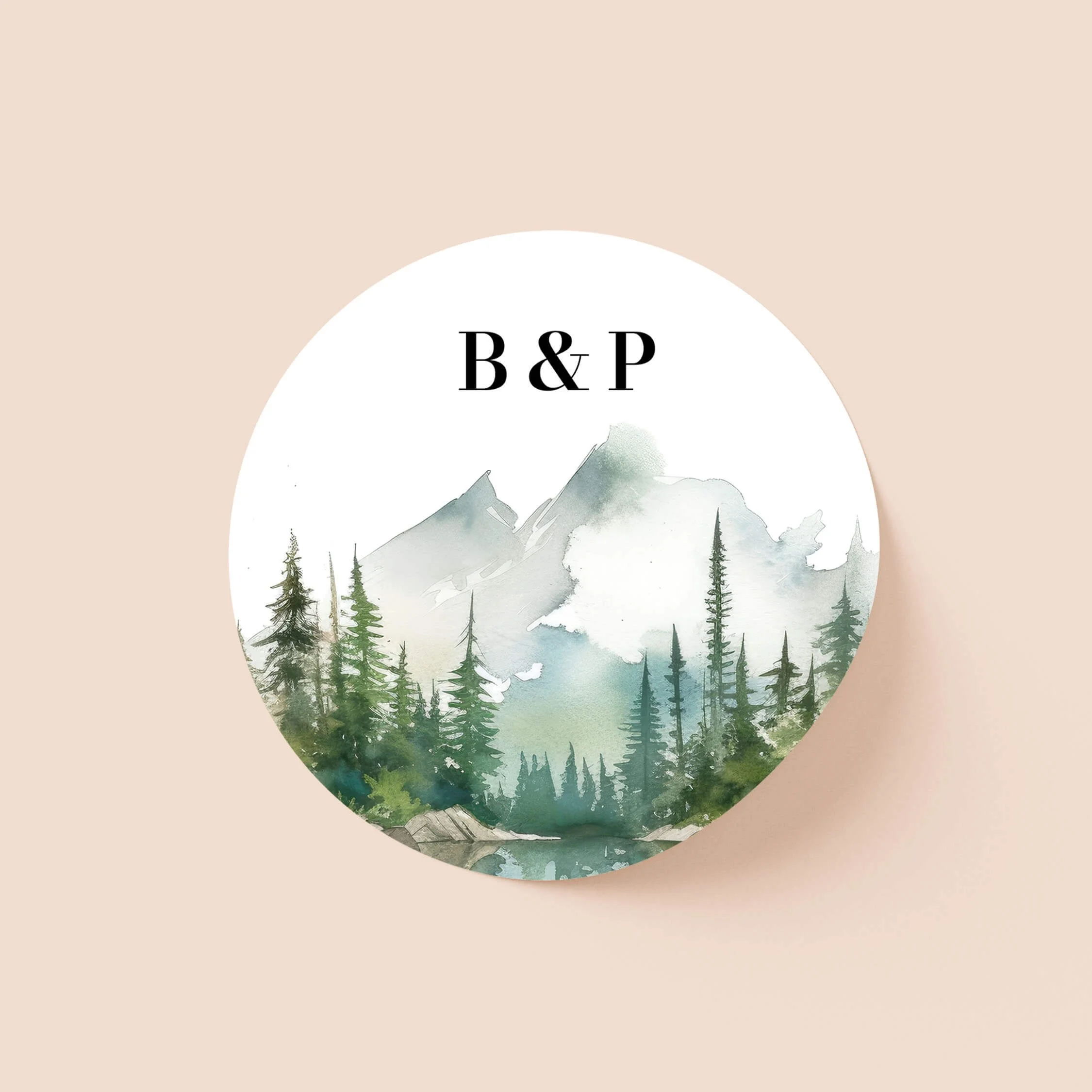 Wilderness personalised wedding sticker with misty mountain pine forest watercolour illustration and serif initials on round sticker