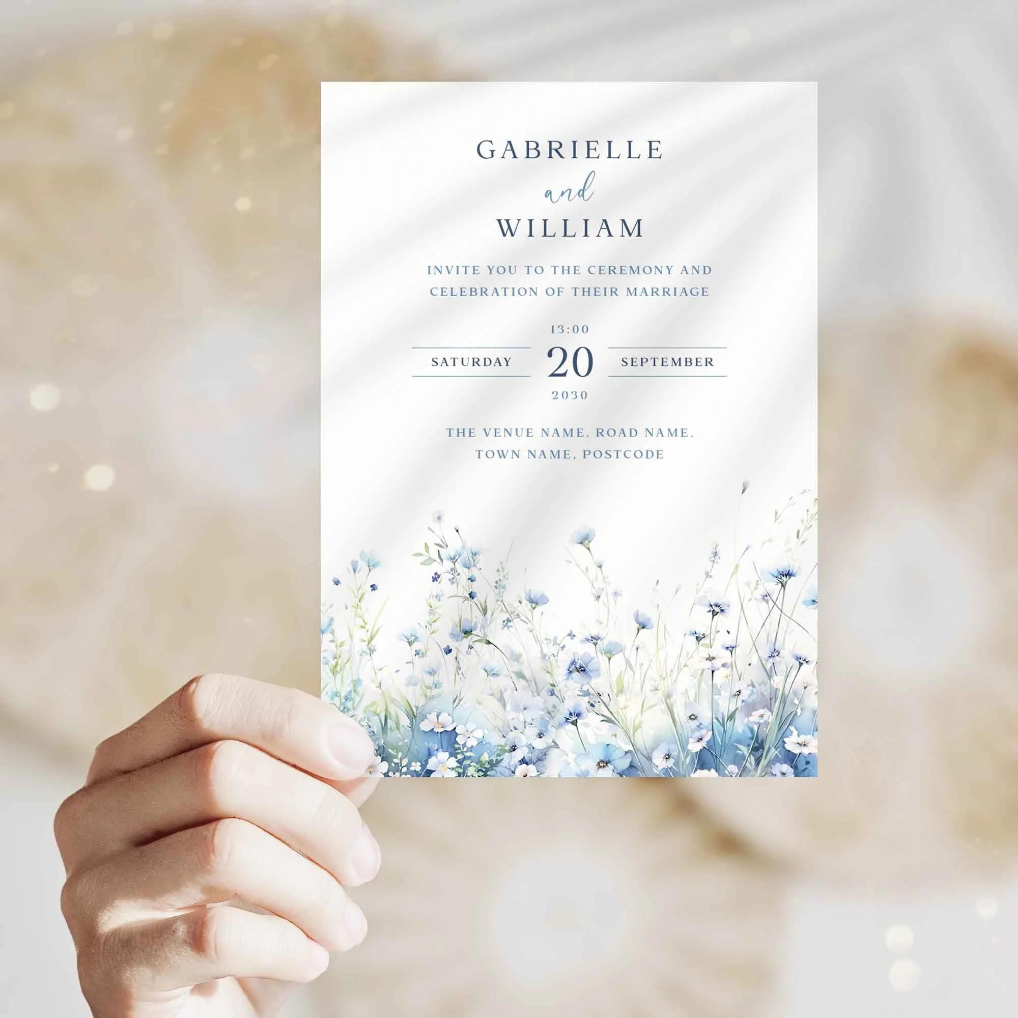 Hand holding Field Dusty Blue wedding invitation showing size and printed design details