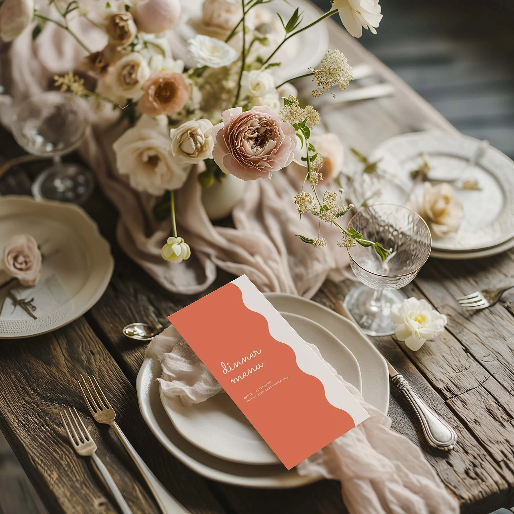 Pastel Orange Scallop wedding menu card styled on a wedding table setting with tableware and décor
