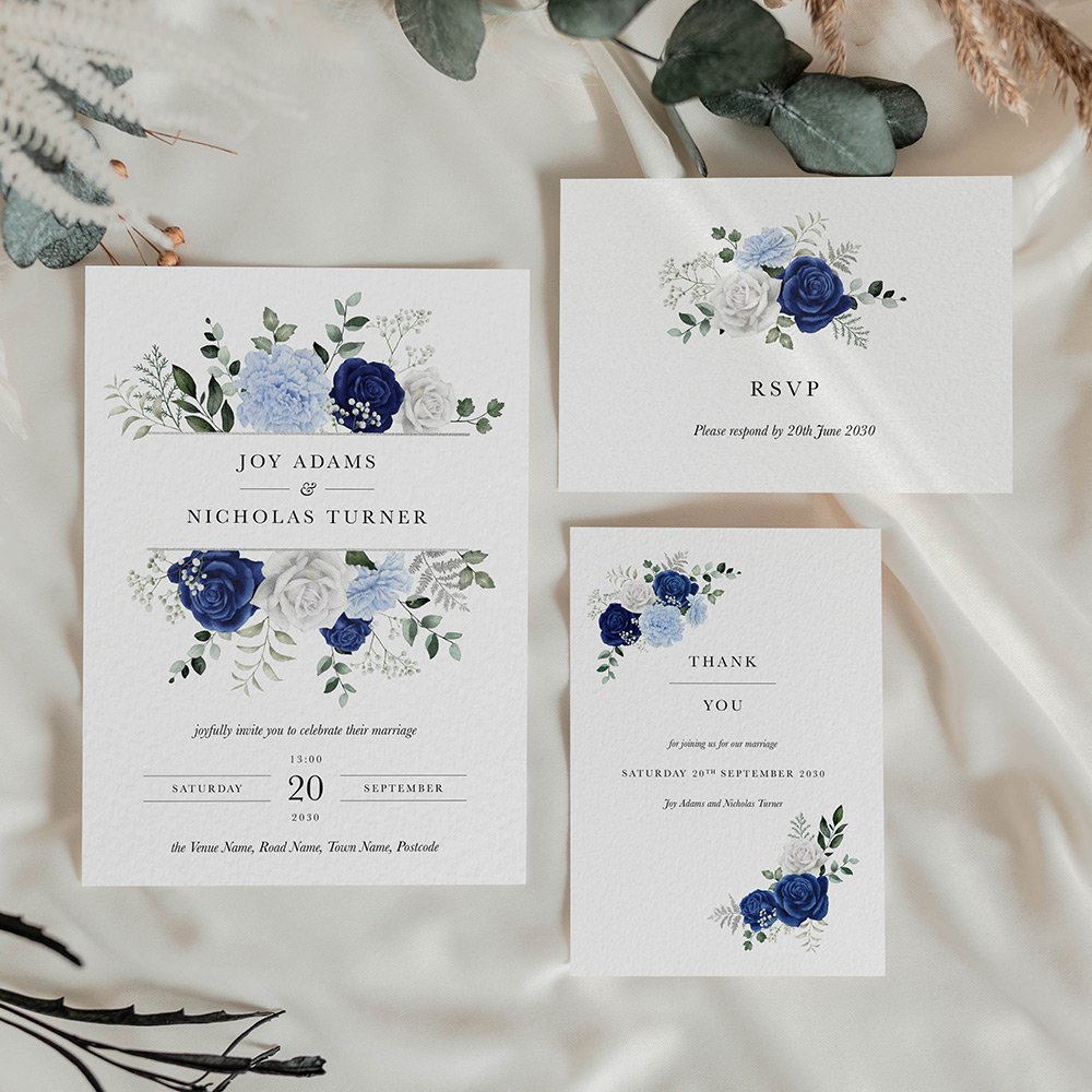 Wedding stationery suite with invitation, RSVP, and thank you card featuring a bold floral bouquet in blue tones.