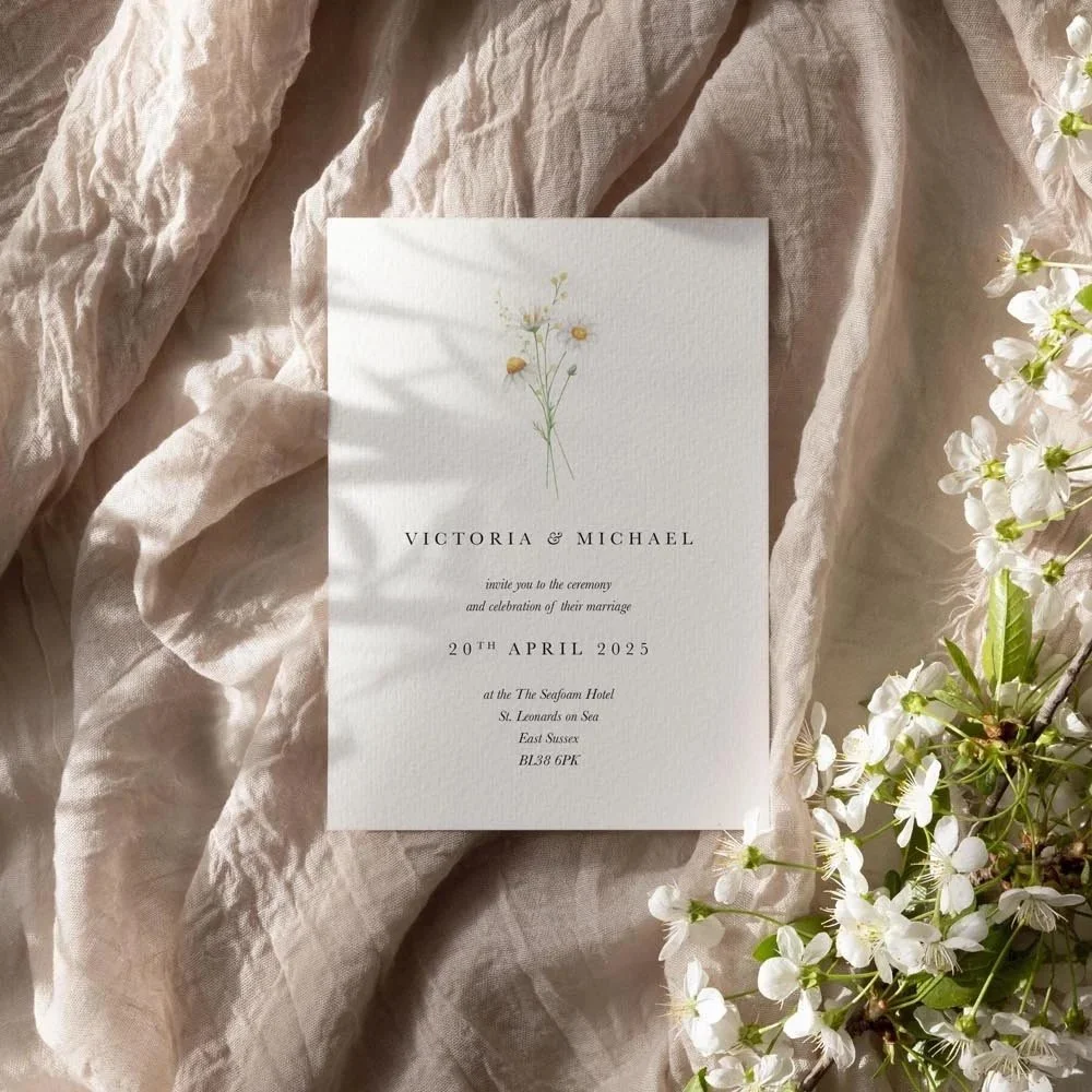 Daisy Collection wedding stationery featuring yellow and white watercolour-style daisies with soft green leaves and elegant modern typography