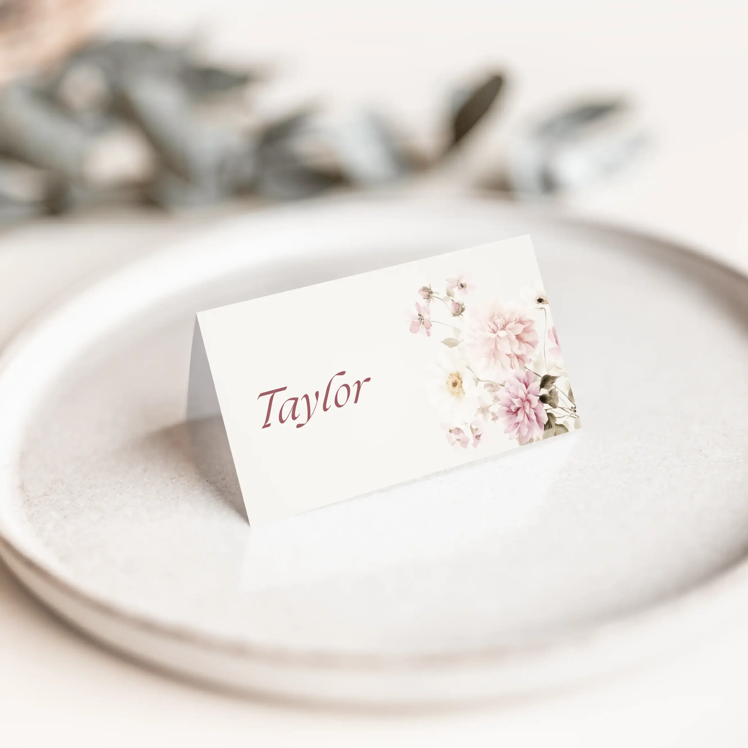 Blush petal wedding place card with soft floral corner detail