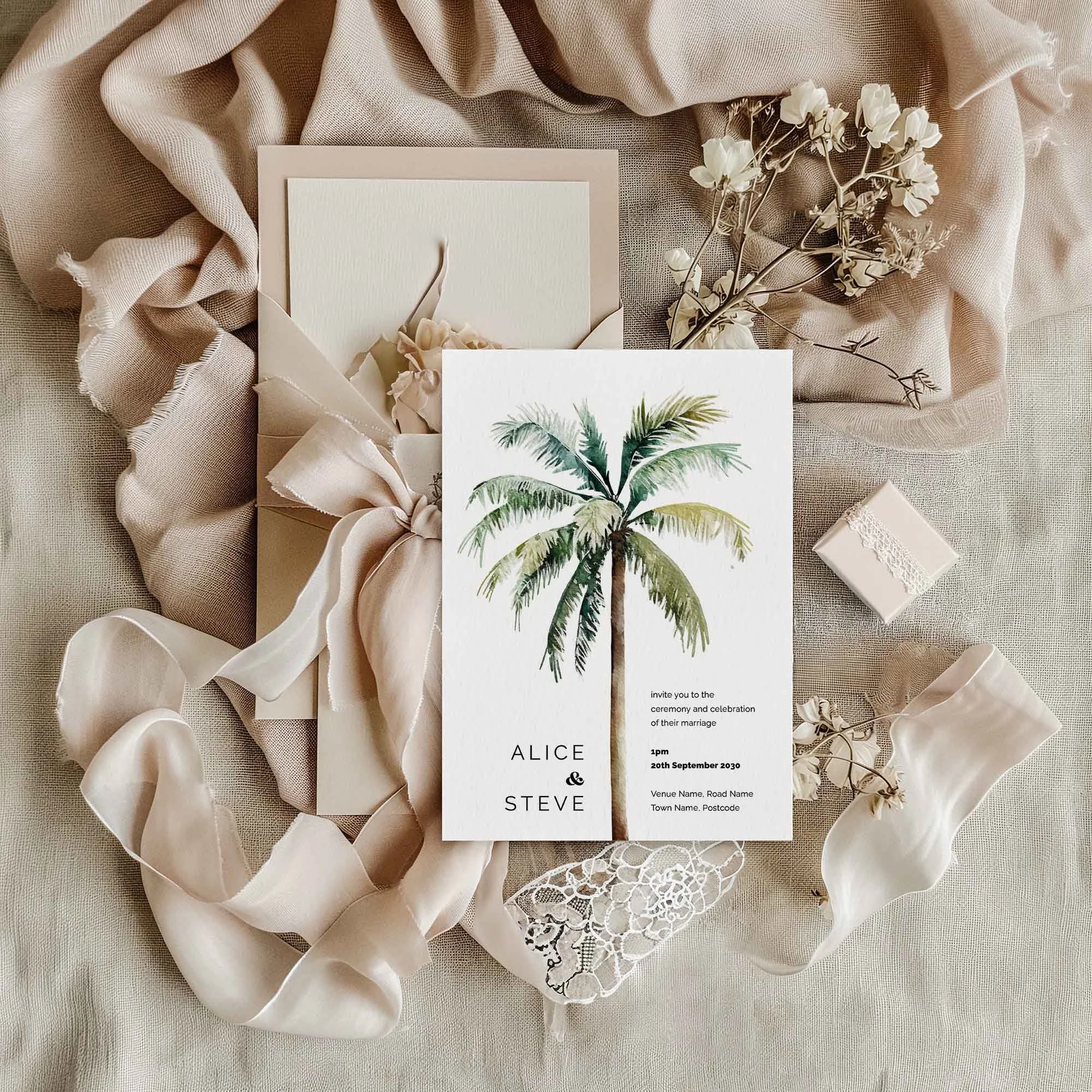 Palm Tree wedding invitation styled in a flat lay environment with wedding props