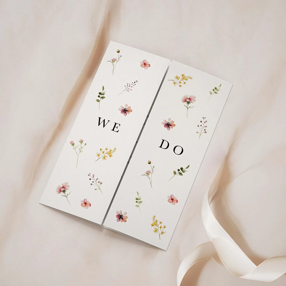 Pink floral gatefold wedding invitation with watercolour-style blooms and elegant layout