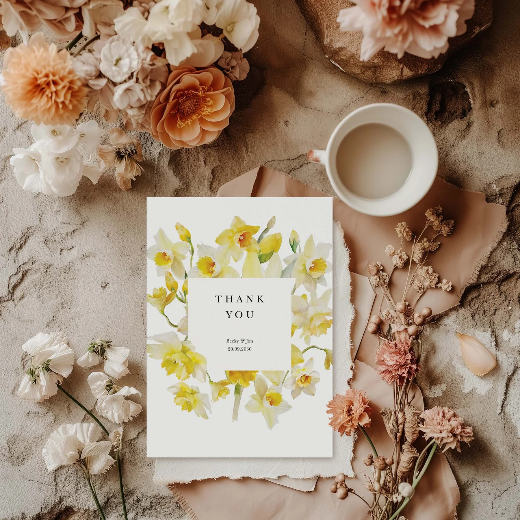 Daffodil wedding thank you card styled with flowers and stationery details