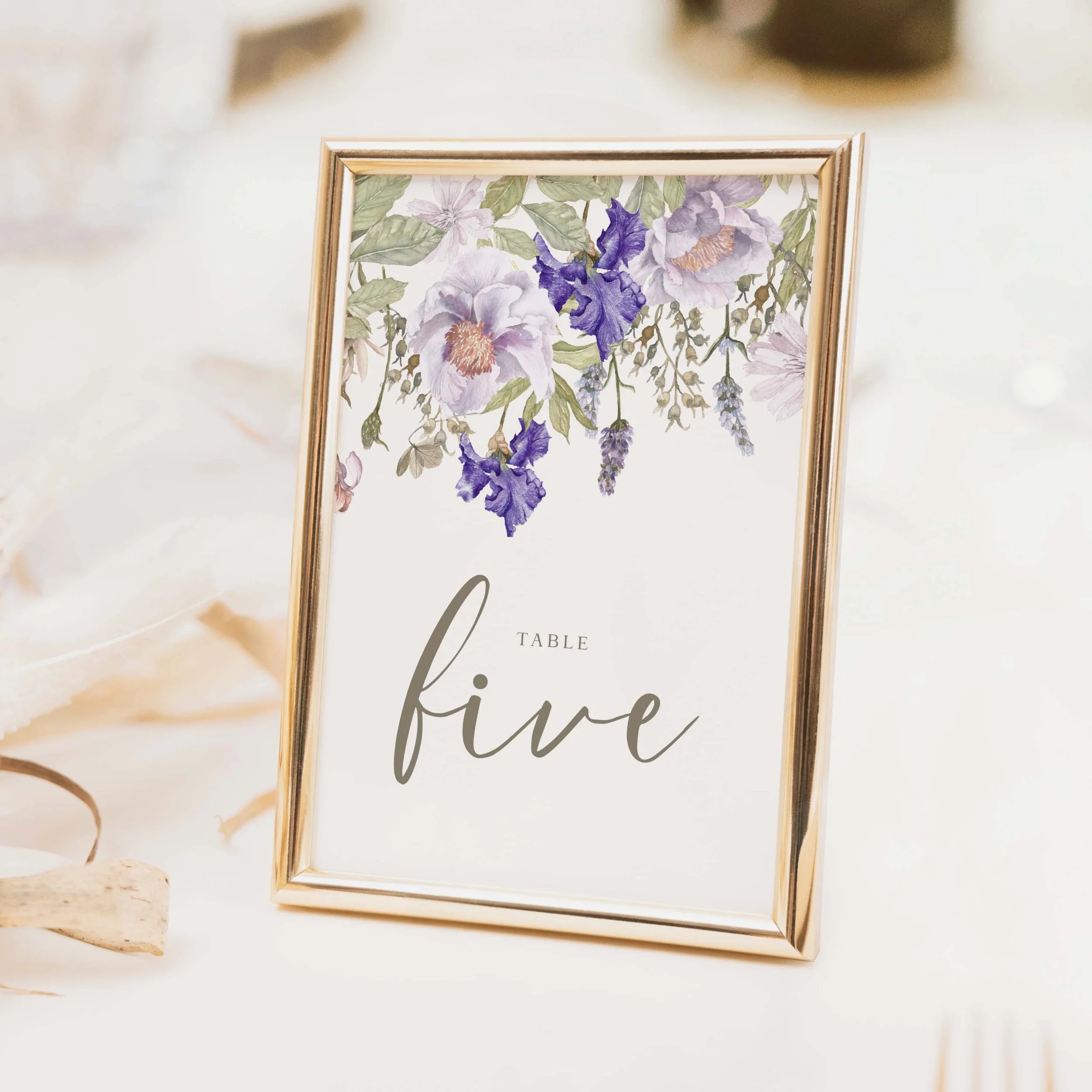 Purple Floral wedding table number with rich purple violet and blue watercolour floral arrangement and calligraphy script typography on luxury off-white card