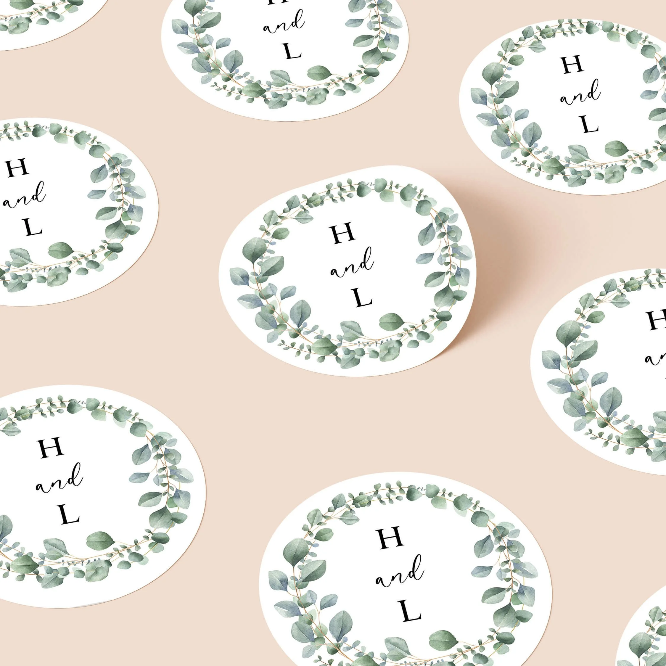 Eucalyptus Foliage wedding stickers with green foliage wreath and initials repeated on personalised round seals