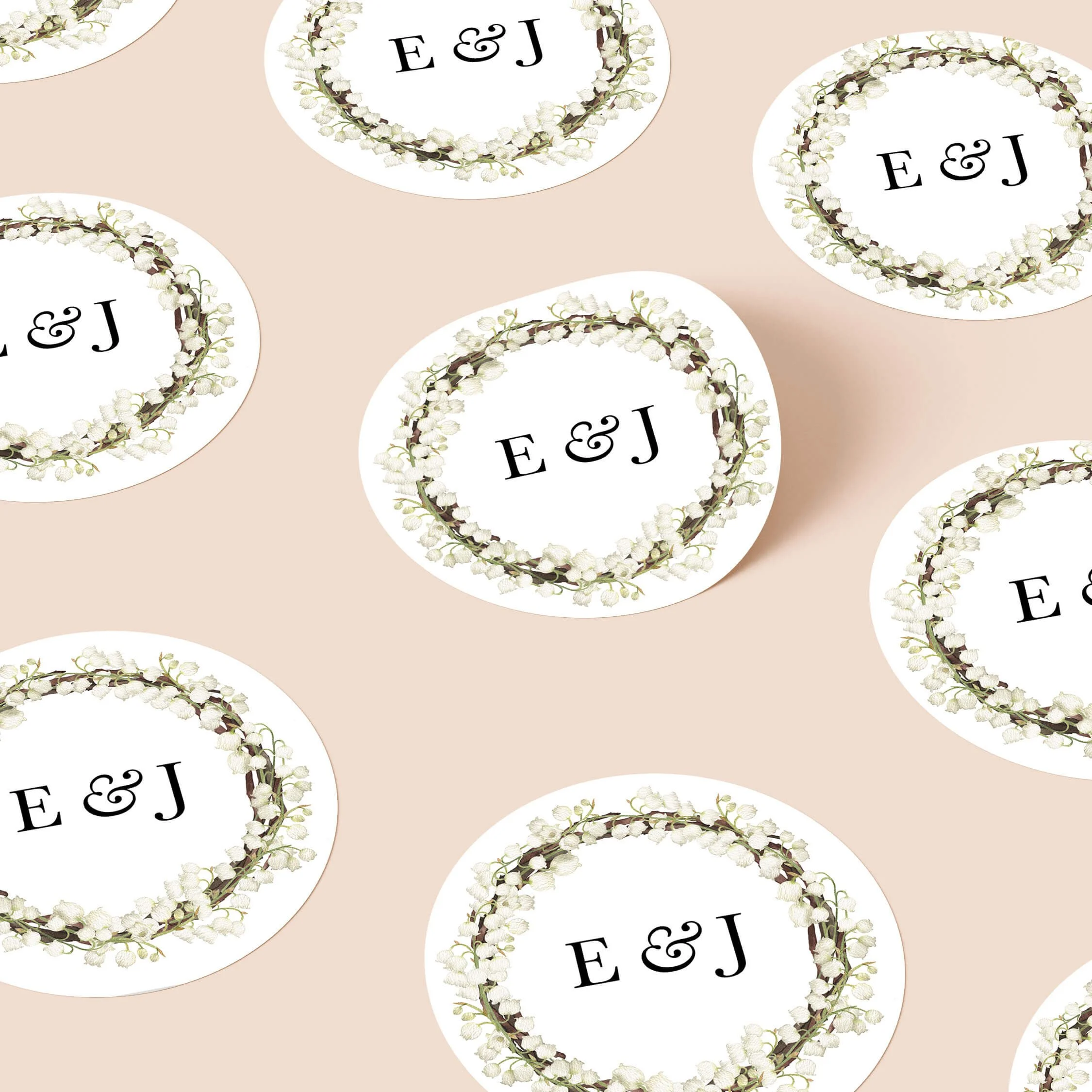 Garden personalised wedding sticker with ivory floral wreath design and elegant initials on round sticker