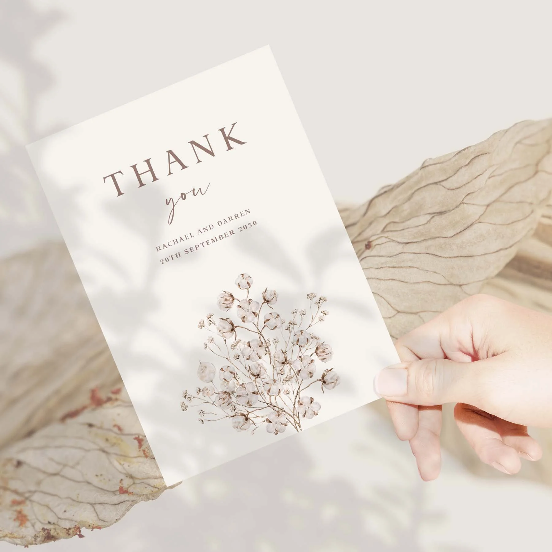 Hand holding a Dried Floral wedding thank you card