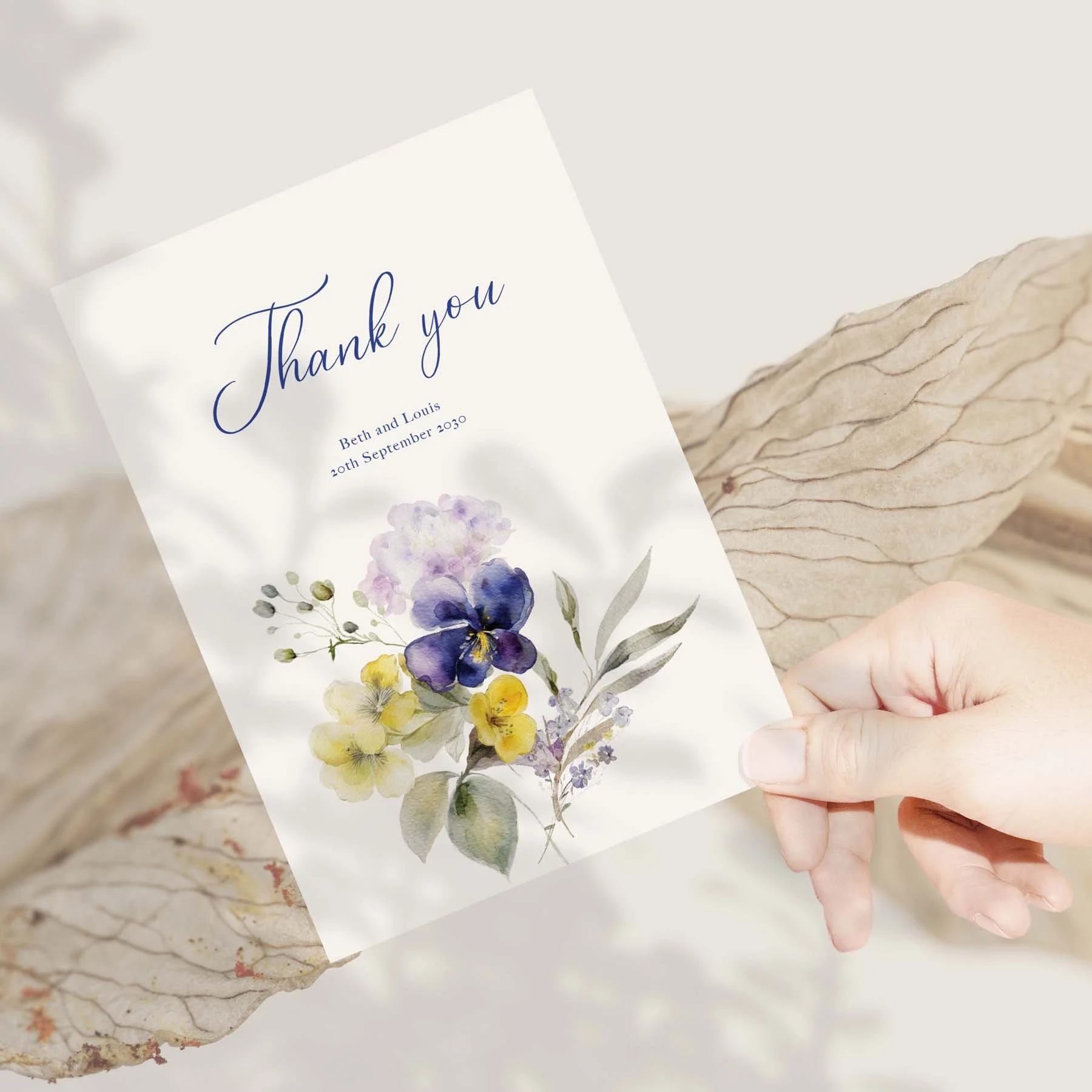 Hand holding a Violet wedding thank you card