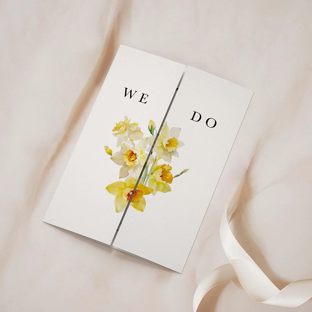 Daffodil Collection gatefold wedding invitation closed, showing soft yellow daffodils in a minimal spring-inspired layout.