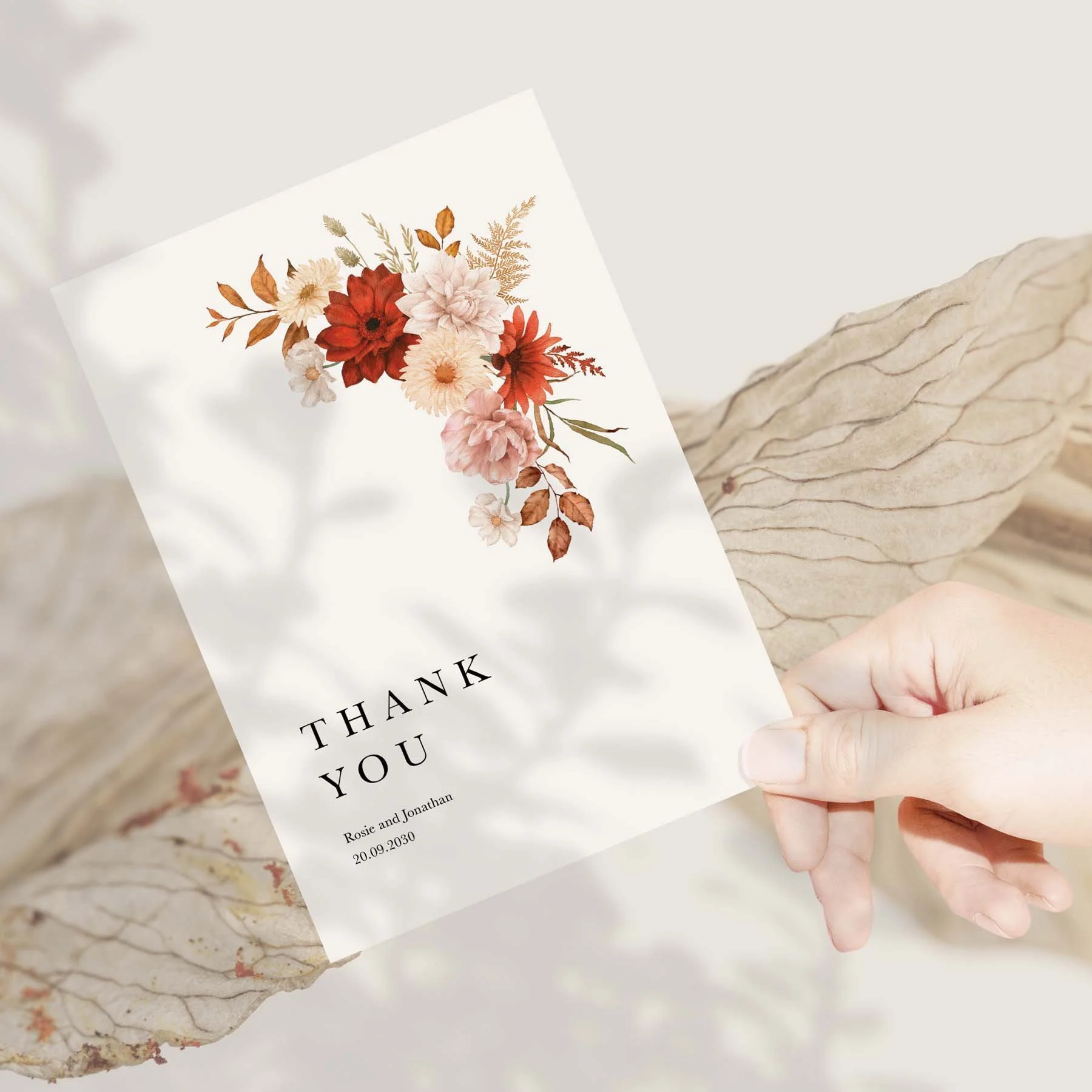 Hand holding an Orange Rustic Florals wedding thank you card