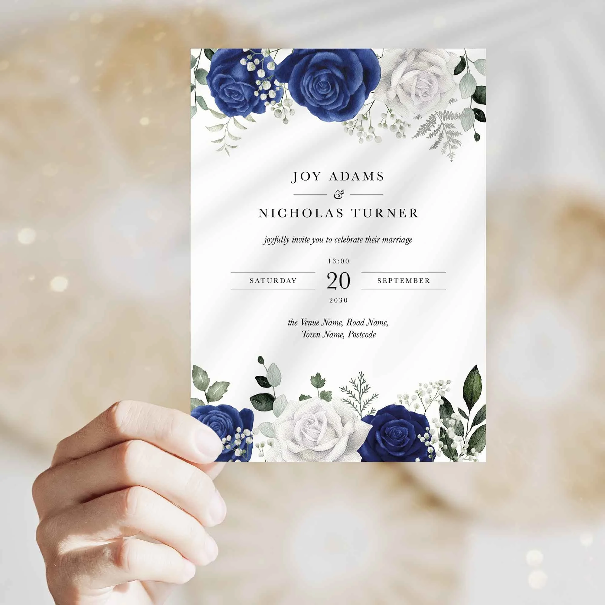 Hand holding Blue and White Floral wedding invitation showing size and printed design details