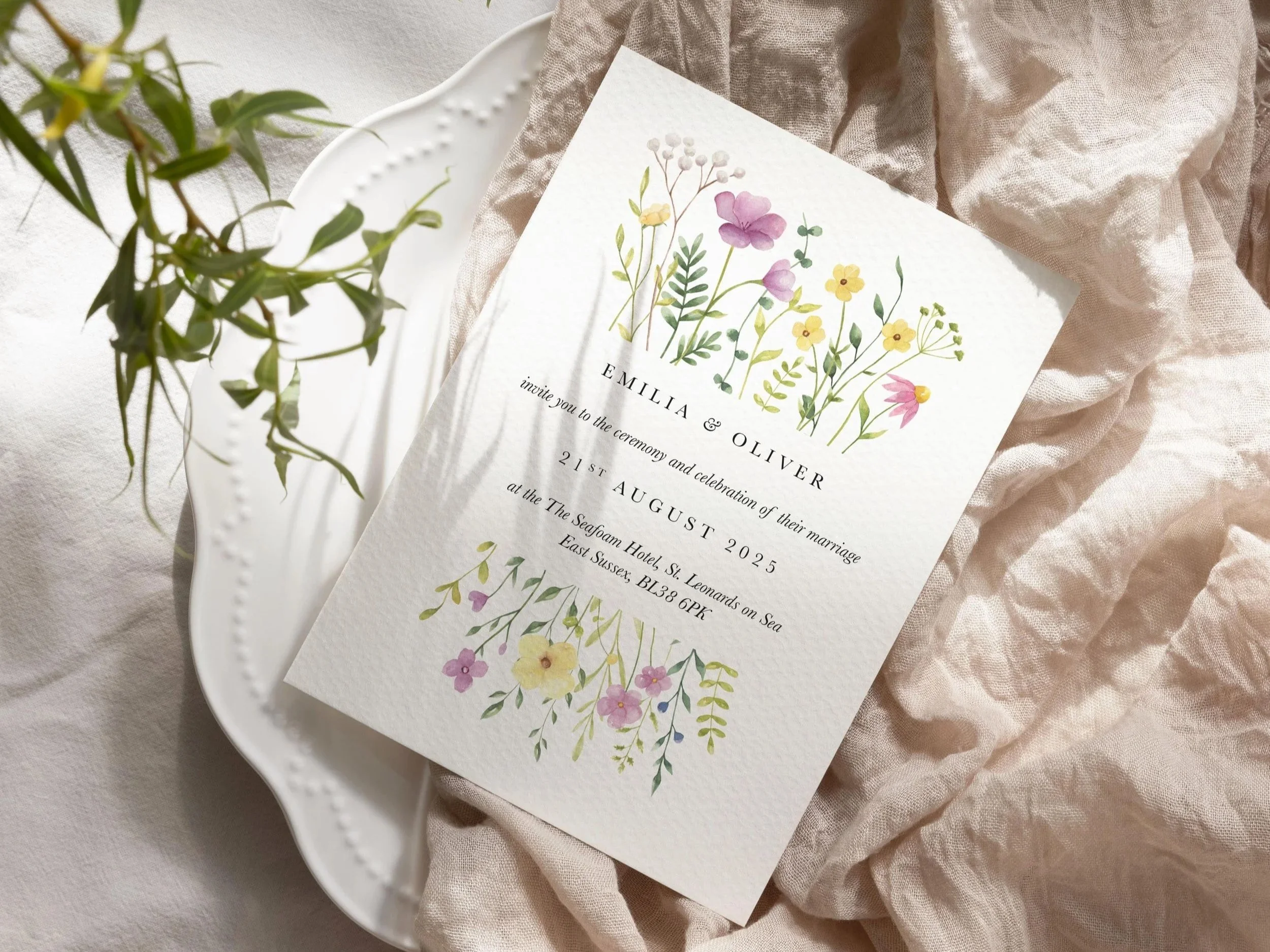 Wildflower Collection wedding stationery with colourful watercolour-style wildflowers and elegant serif typography in a rustic meadow-inspired design