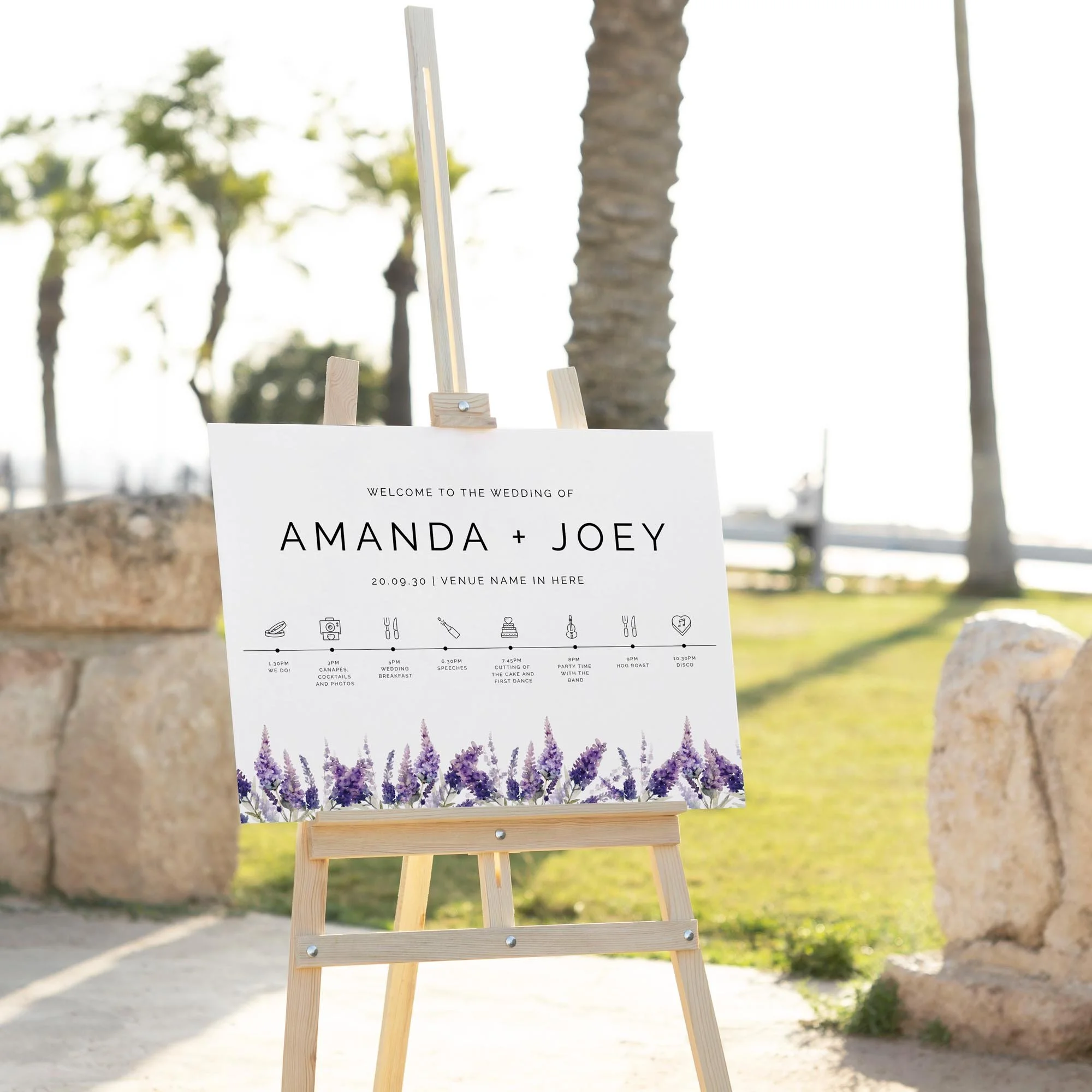 Lavender wedding welcome sign displayed outdoors at a wedding venue on an easel
