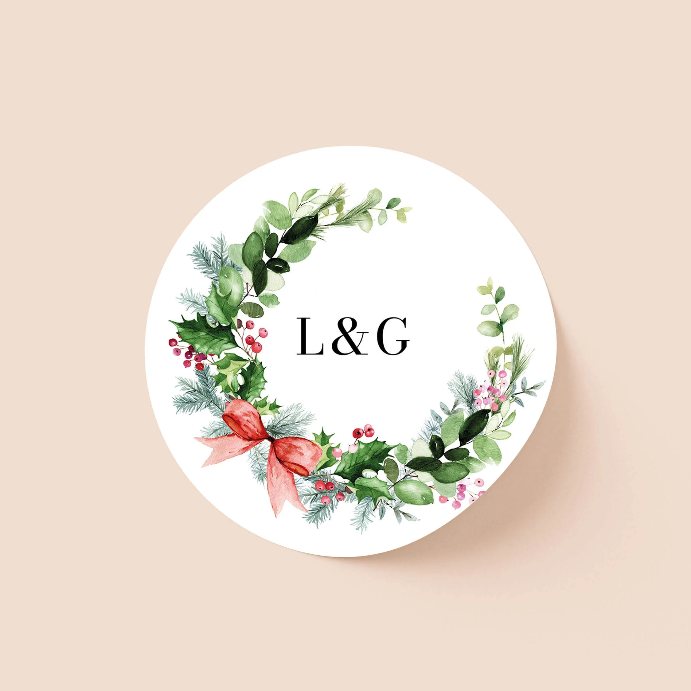 Festive wedding sticker with Christmas greenery wreath and initials on round personalised seal