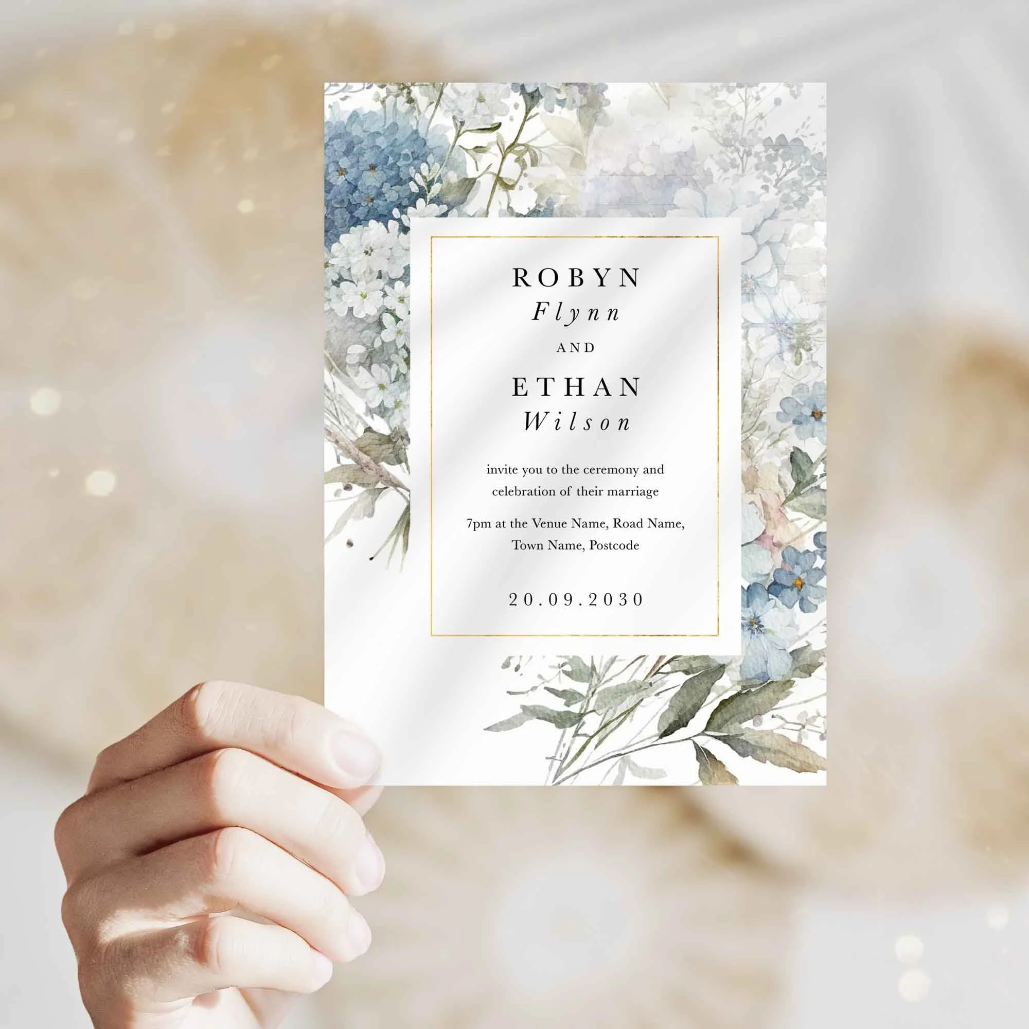 Hand holding Dusty Blue wedding invitation showing size and printed design details