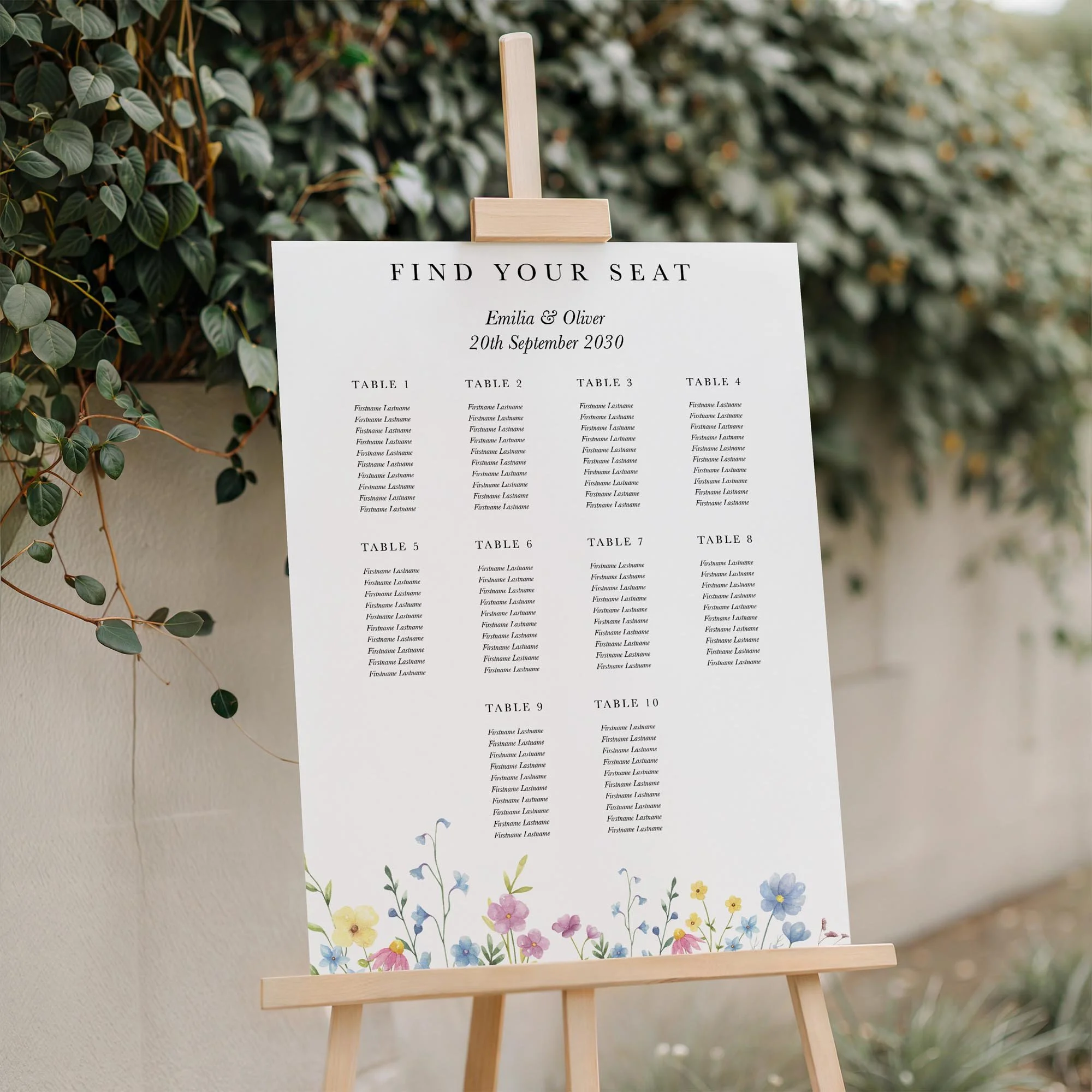 Close-up of the Colourful Wildflower wedding seating plan board displayed outdoors