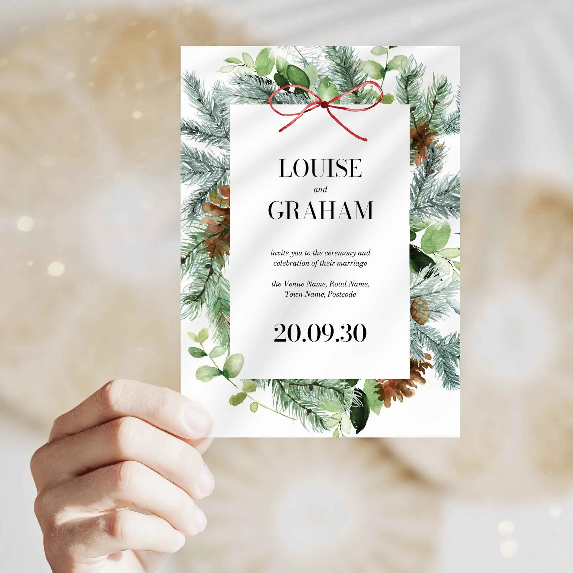 Hand holding Christmas wedding invitation showing size and printed design details