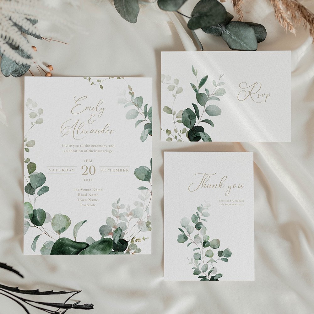 Emerald green and gold wedding invitation card with elegant forest foliage and refined botanical details.