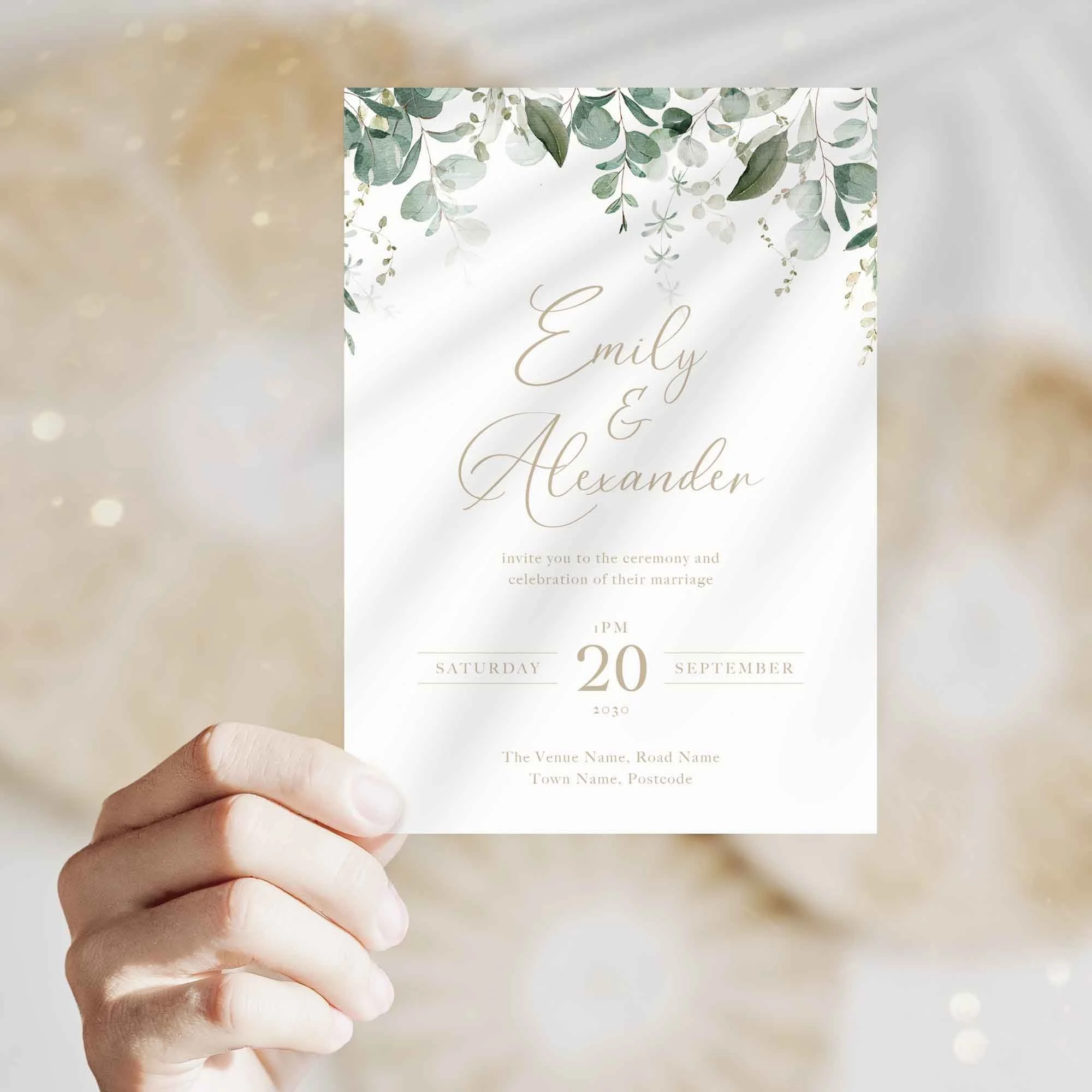 Hand holding Emerald Greenery wedding invitation showing size and printed design details