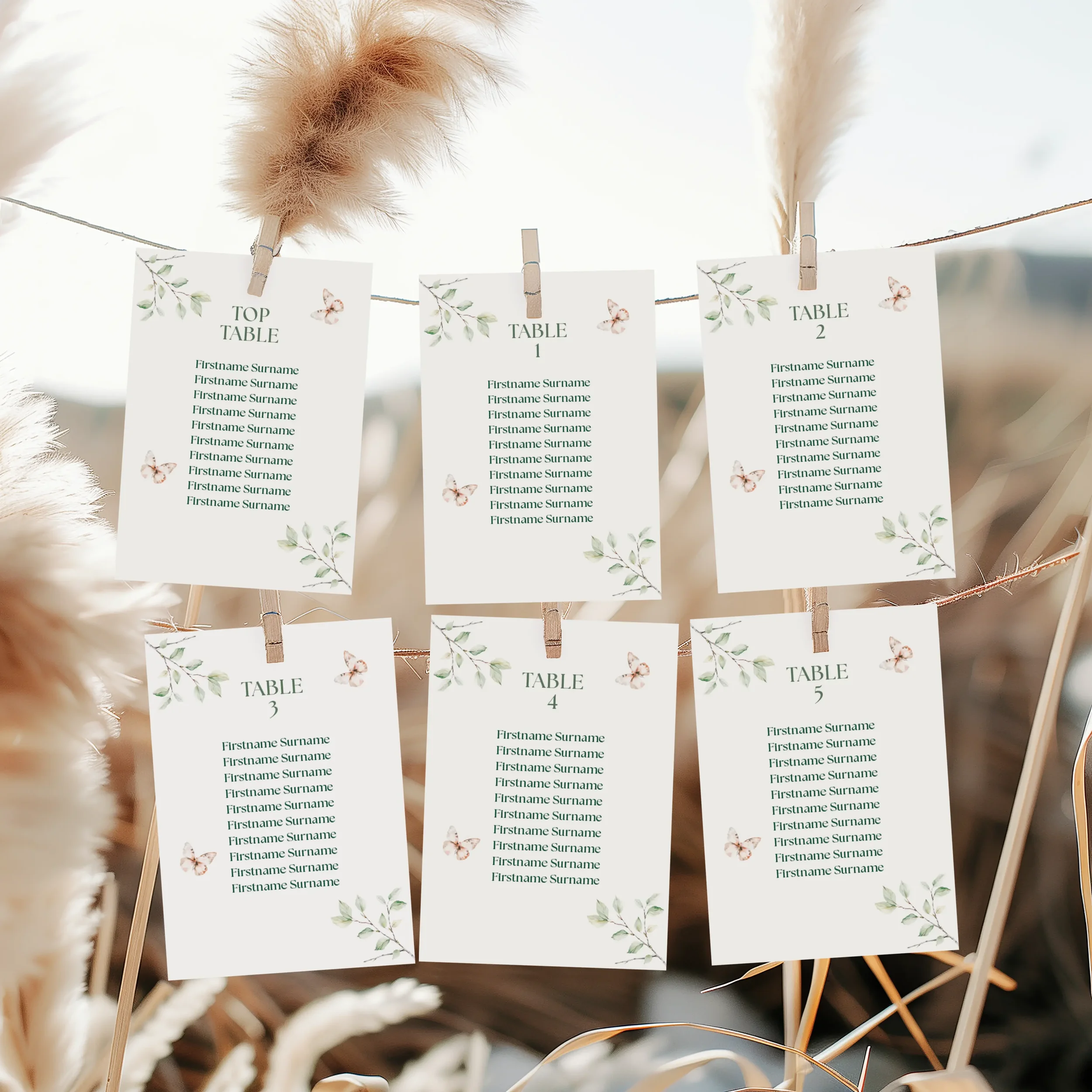 Adventure Wedding Seating Plan Cards with woodland illustrations of leaves and butterflies.