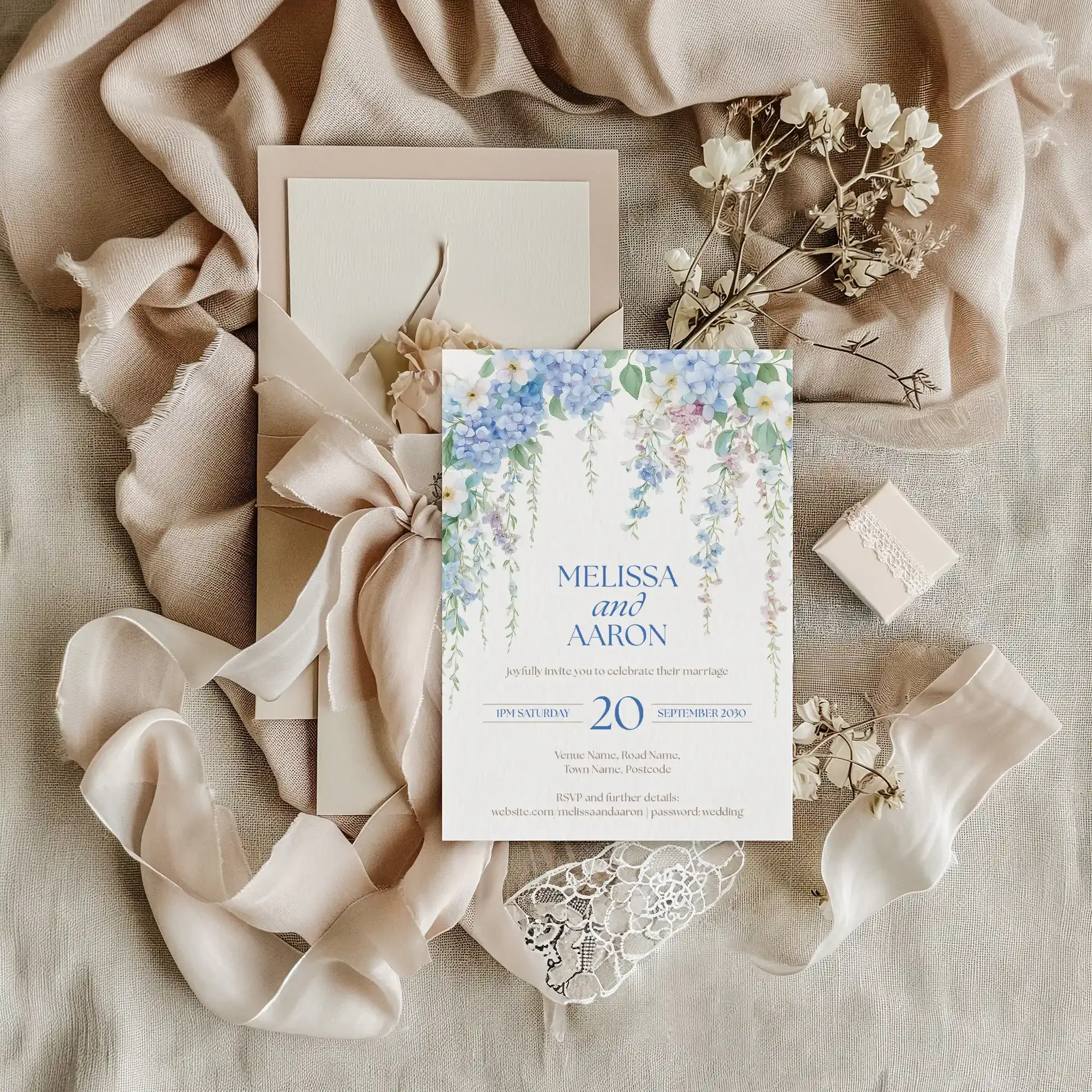 Styled flatlay of the Serenity Wedding Invitation featuring elegant blue floral wedding details.
