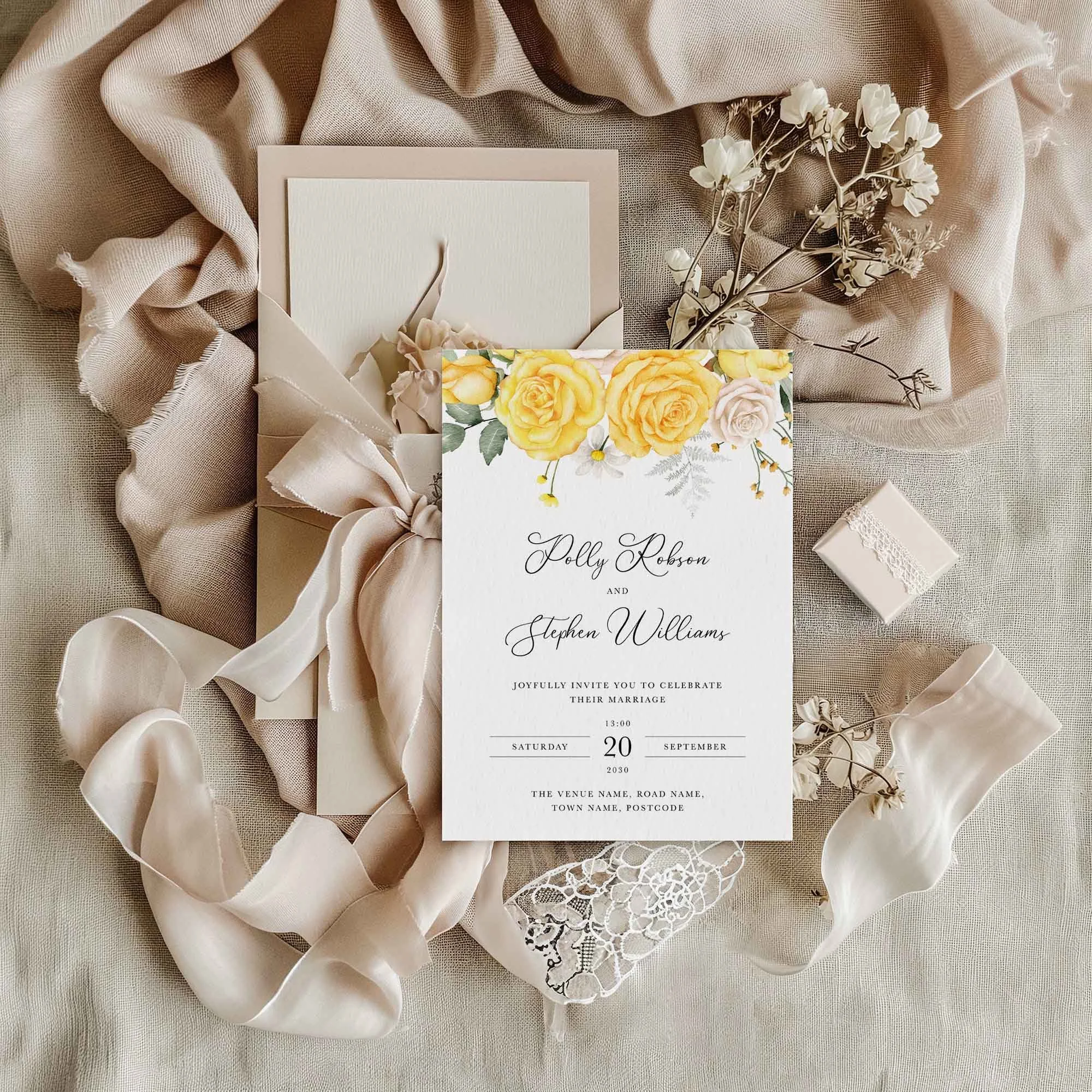 Yellow Rose wedding invitation styled in a flat lay environment with wedding props