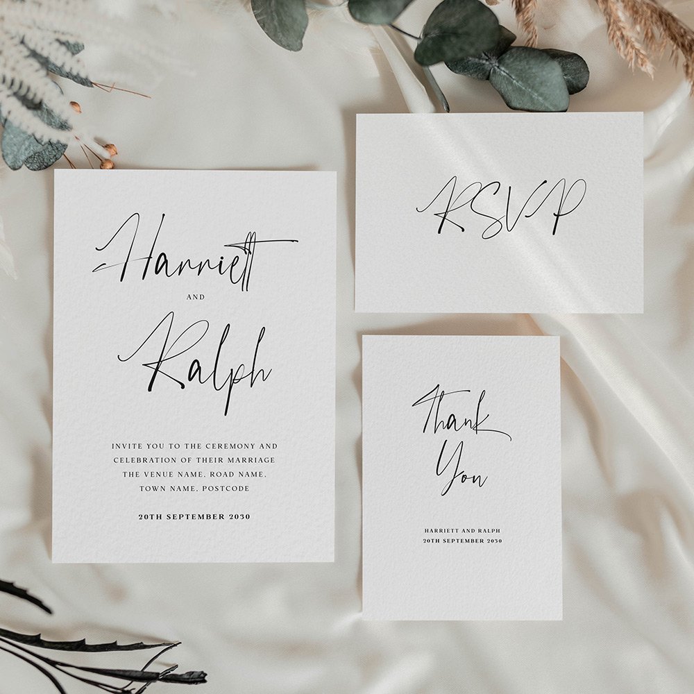 Save the date card with expressive handwritten script in black on white, combining playful personality with a modern, minimal wedding aesthetic.