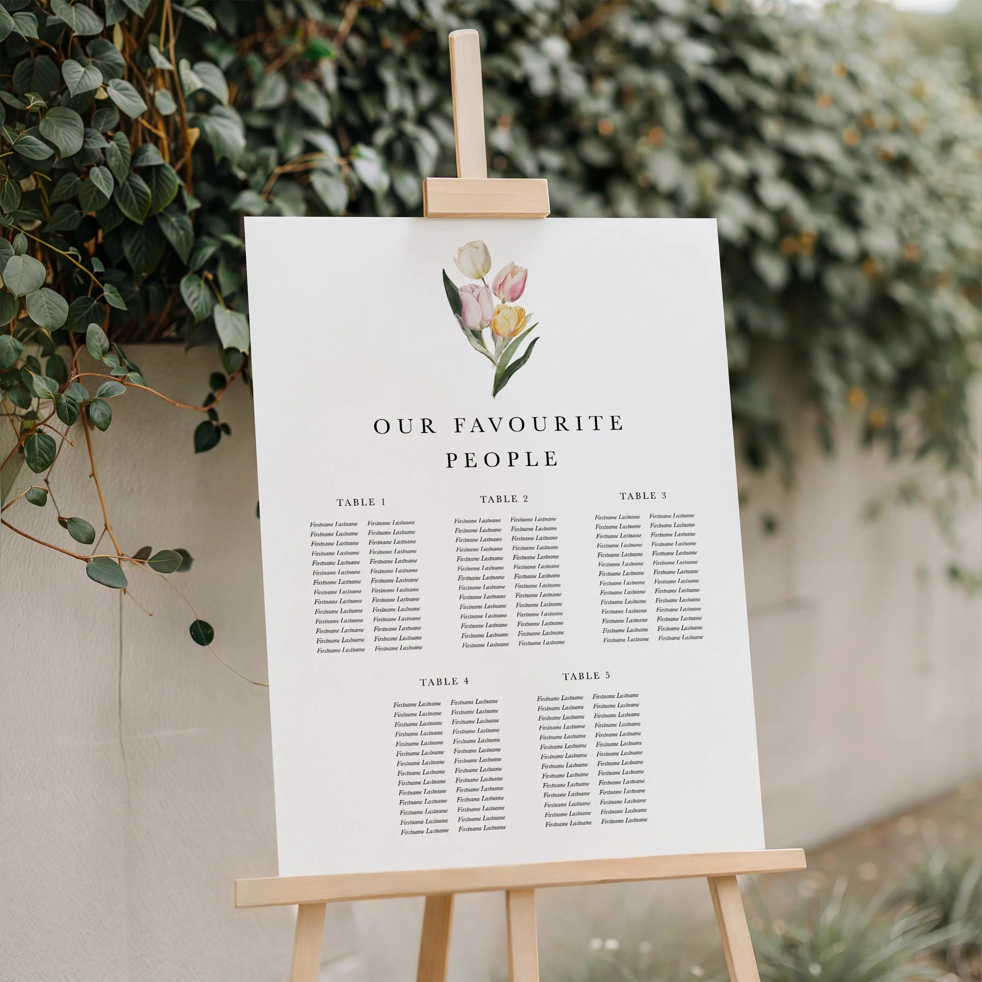 Close-up of the Tulip wedding seating plan board displayed outdoors