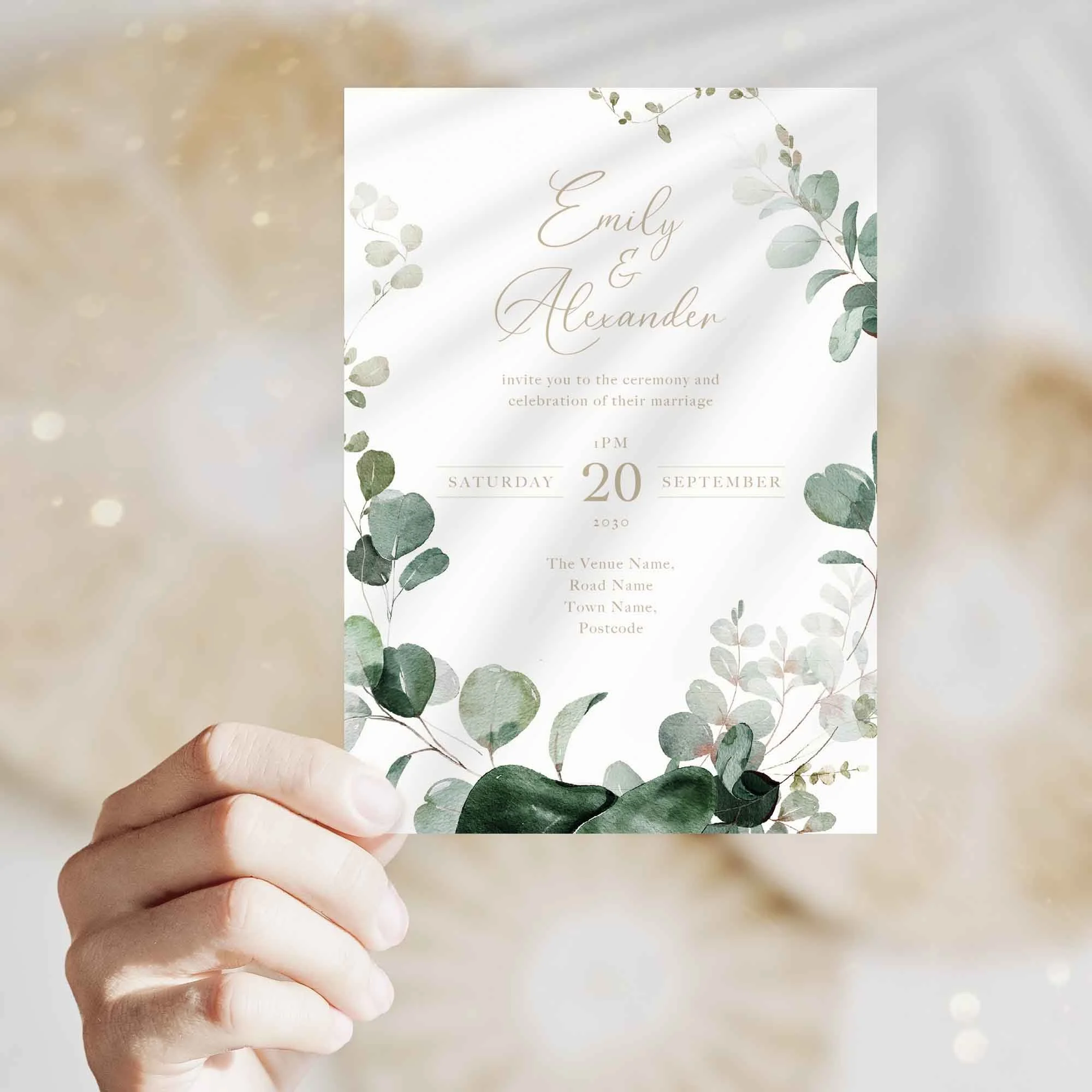 Hand holding Emerald Forest Foliage wedding invitation showing size and printed design details
