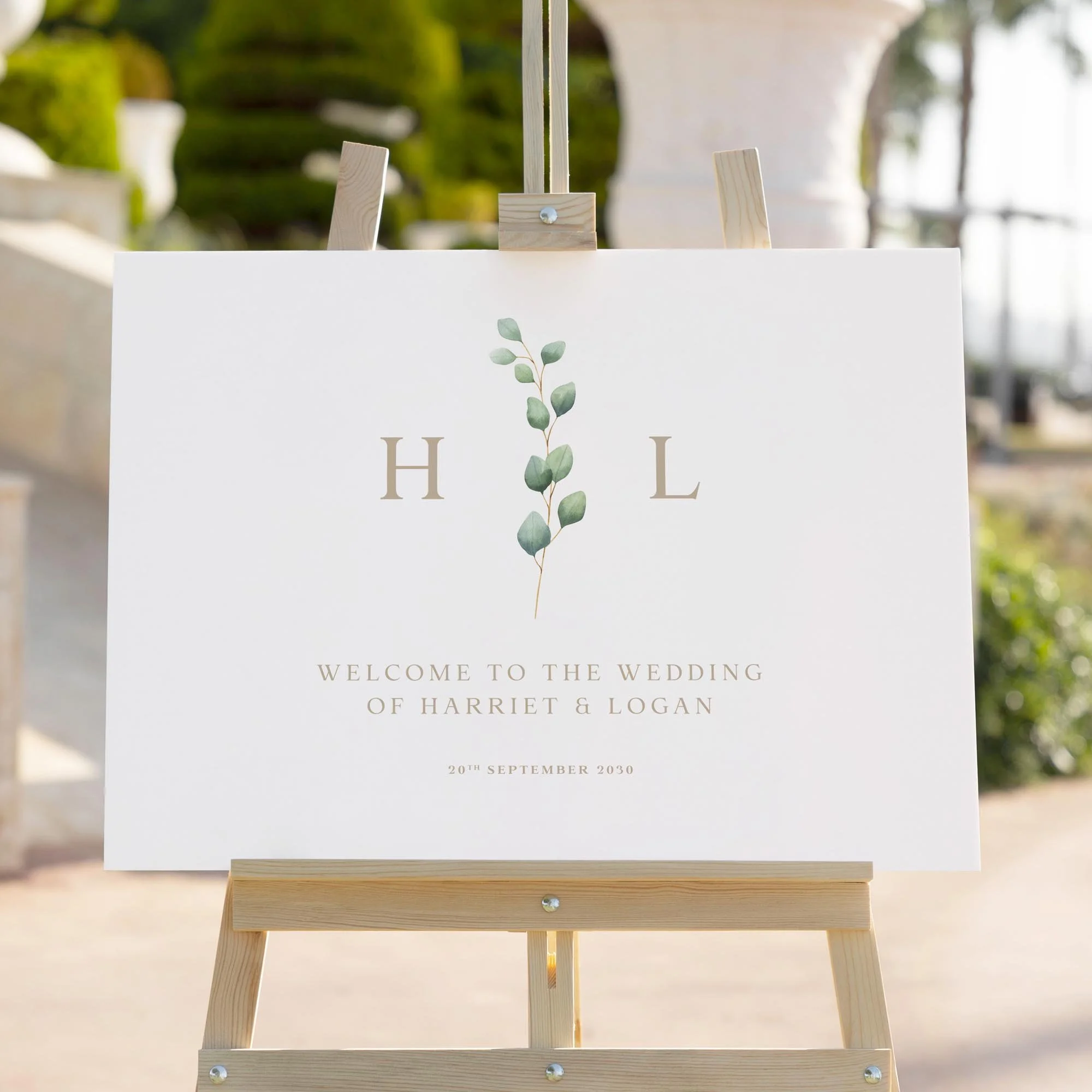 Eucalyptus Monogram wedding welcome sign styled outdoors close-up