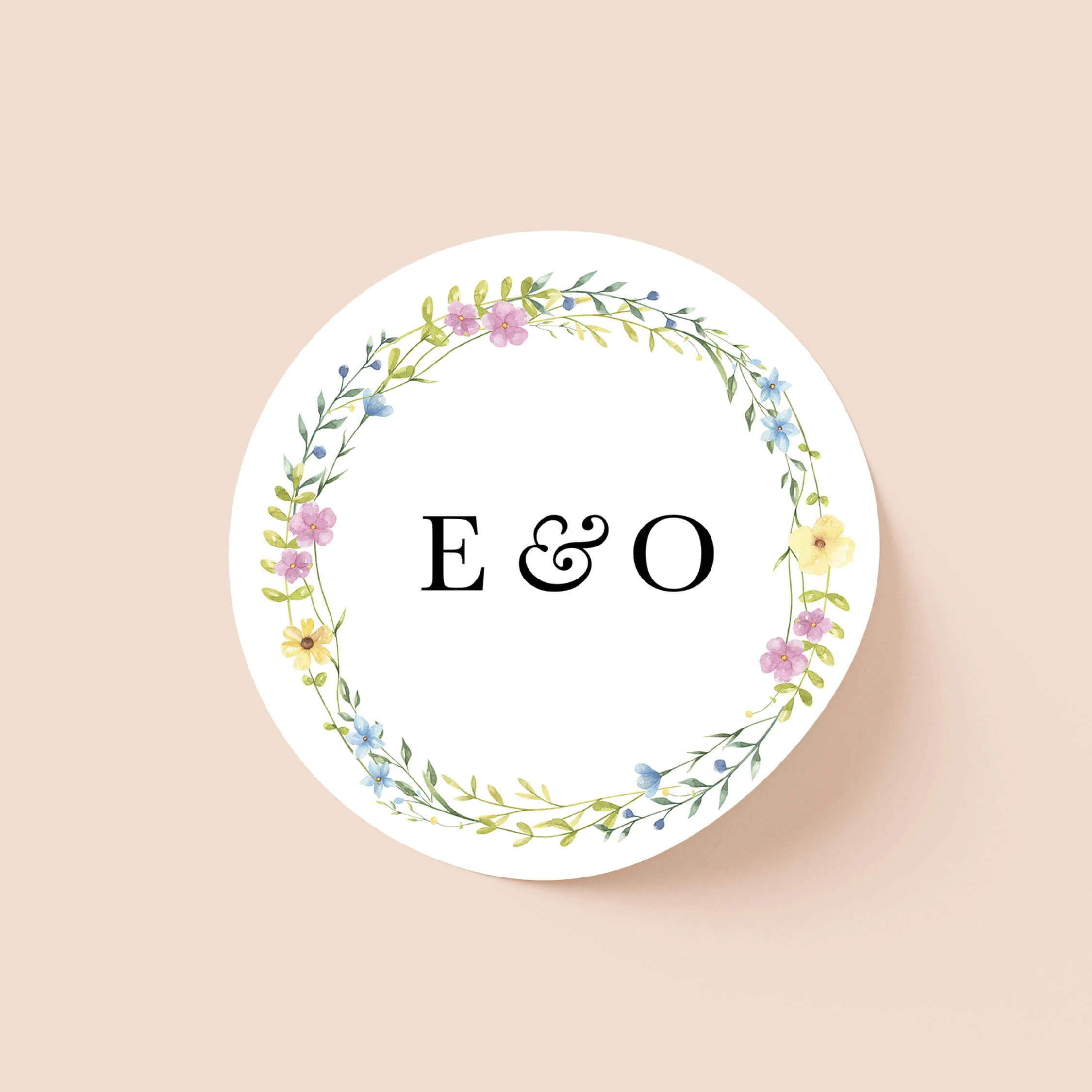 Wildflower personalised wedding sticker with small mixed wildflower circular garland and serif initials on round sticker