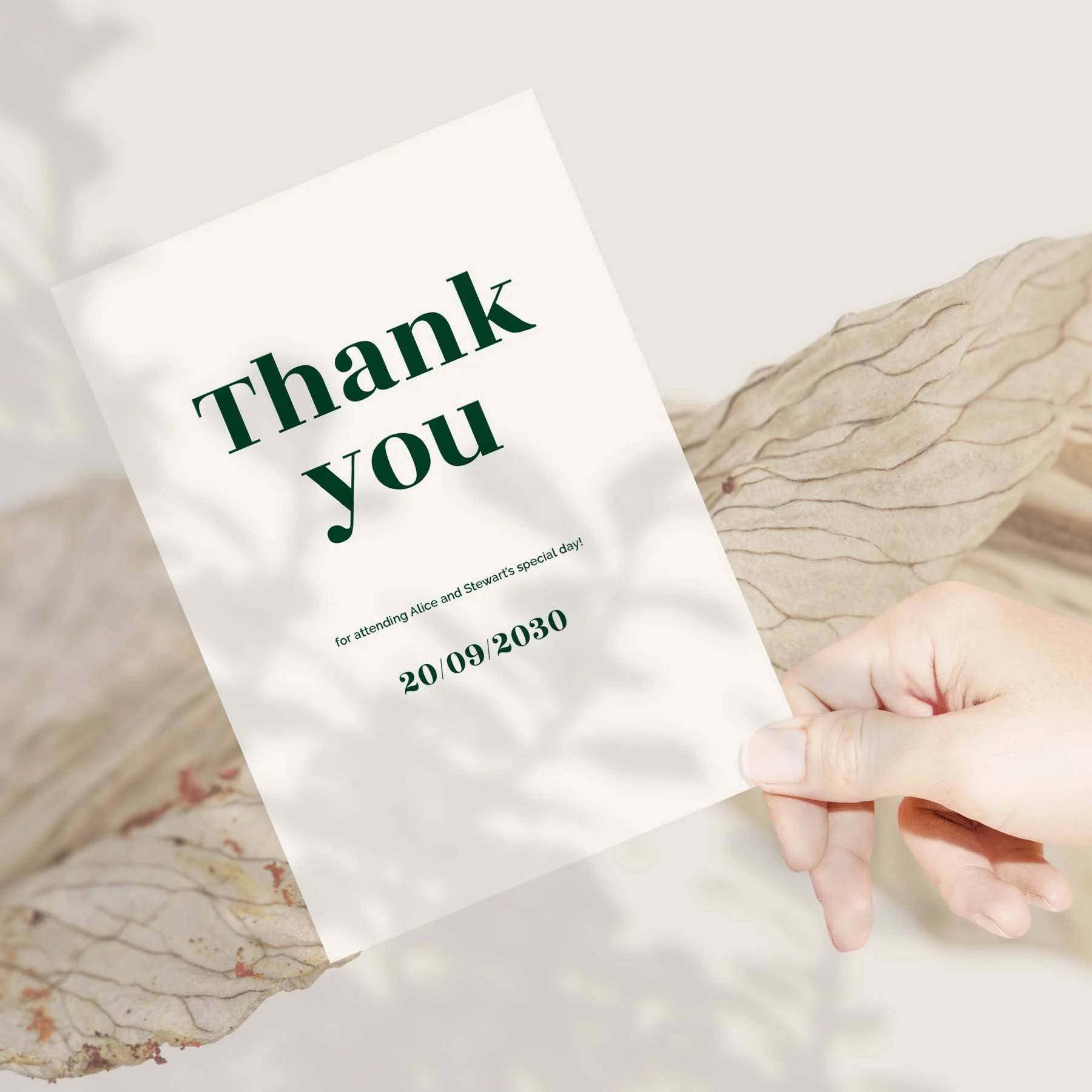 Hand holding a Typography wedding thank you card