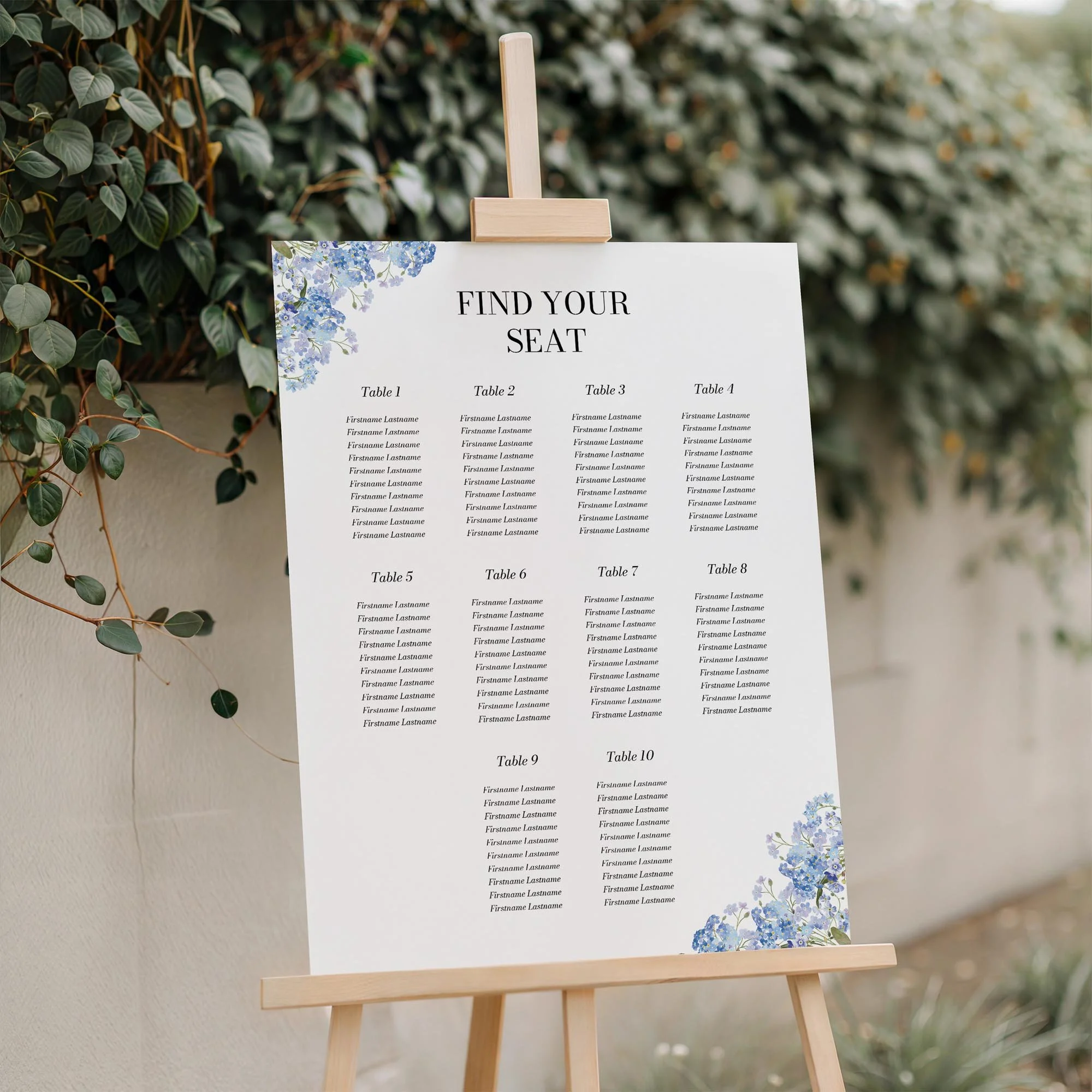 Close-up of the Forget Me Not wedding seating plan board displayed outdoors